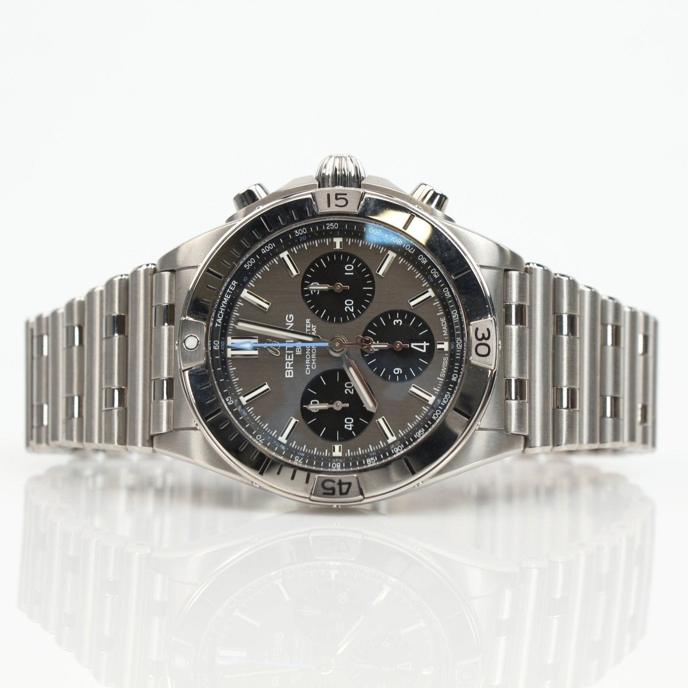 Titanium Breitling Chronomat B01 wristwatch with black dial and chronograph features, displayed on a metal bracelet.