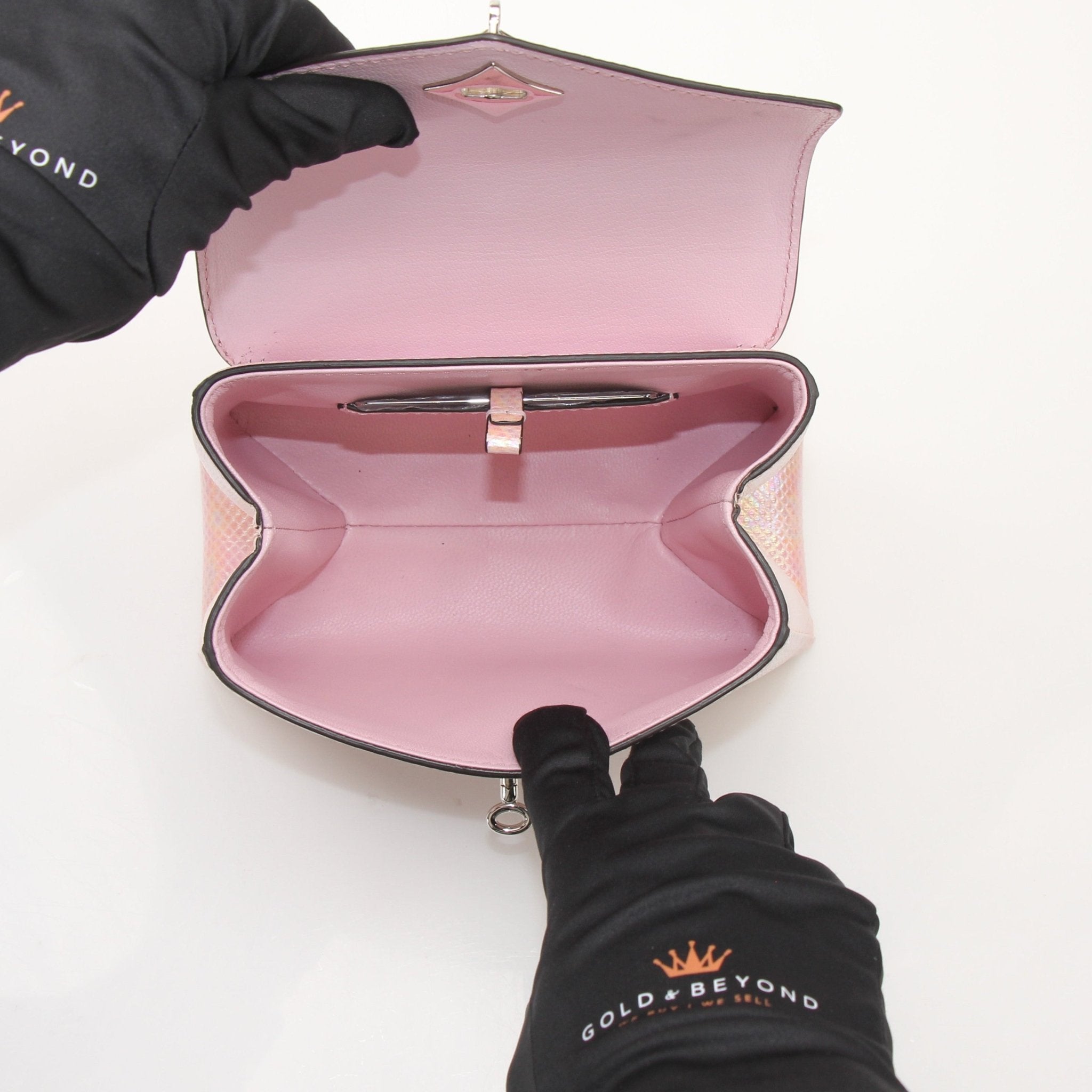 Louis Vuitton iridescent lizard rose des vents mini shoulder handbag with gold hardware and adjustable strap.