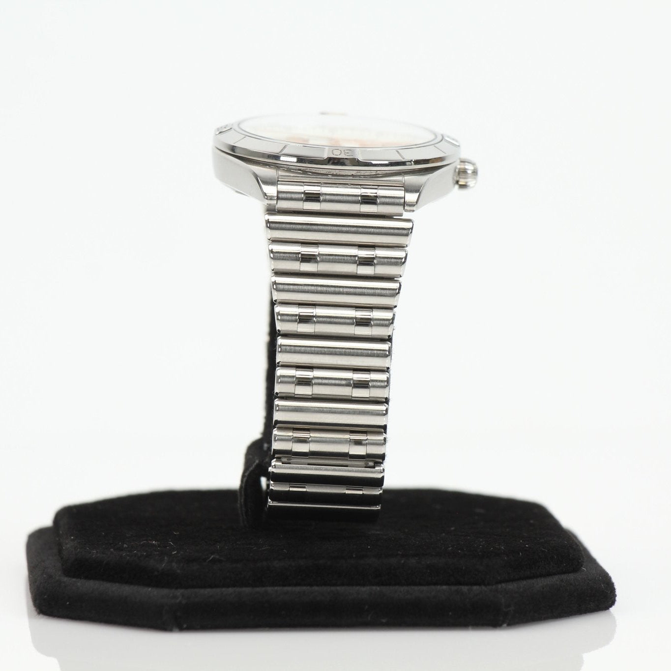 Stainless steel Breitling Chronomat watch with black dial and chronograph subdials, displayed on a wrist.