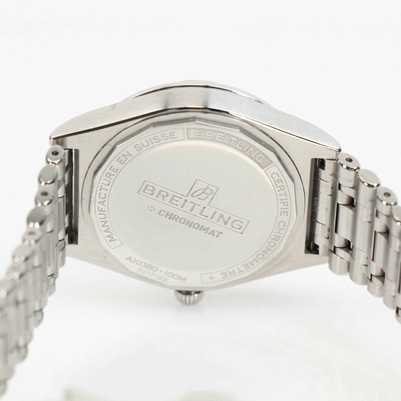 Stainless steel Breitling Chronomat watch with detailed dial and chronograph features, displayed on a neutral background.