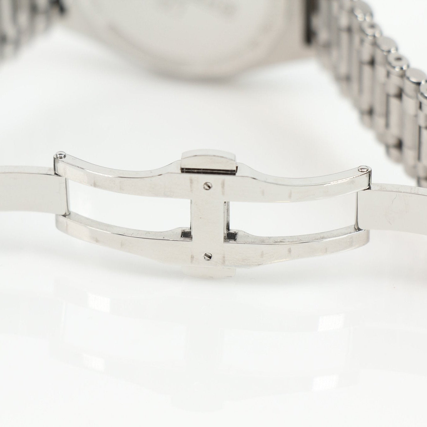 Stainless steel Breitling Chronomat watch with chronograph features, silver dial, and bracelet, displayed on a white background.