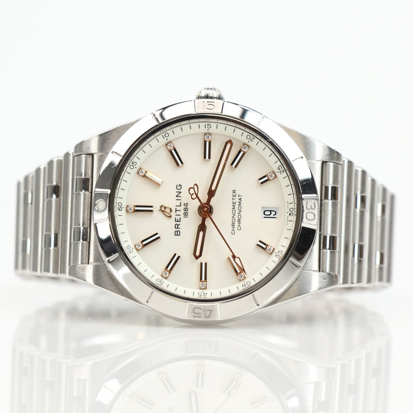 Stainless steel Breitling Chronomat watch with chronograph features and metallic bracelet, displayed on a white background.