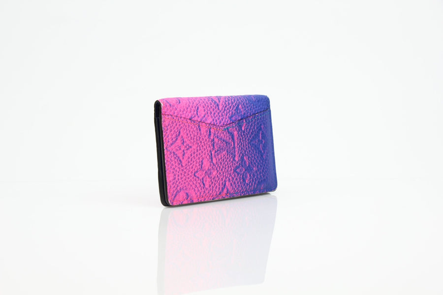 Louis Vuitton Pocket Organizer wallet in gradient monogram leather, showcasing its elegant design and compact size.