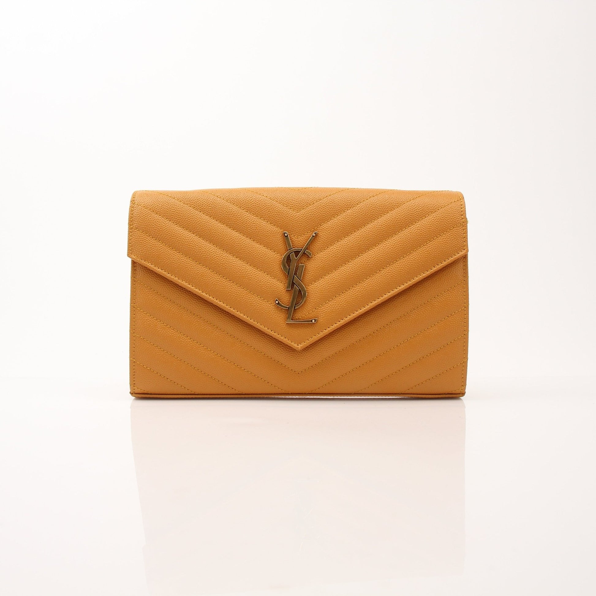 Saint Laurent Matelasse Chevron Monogram Chain Wallet handbag with gold chain and quilted leather, featuring iconic monogram pattern.