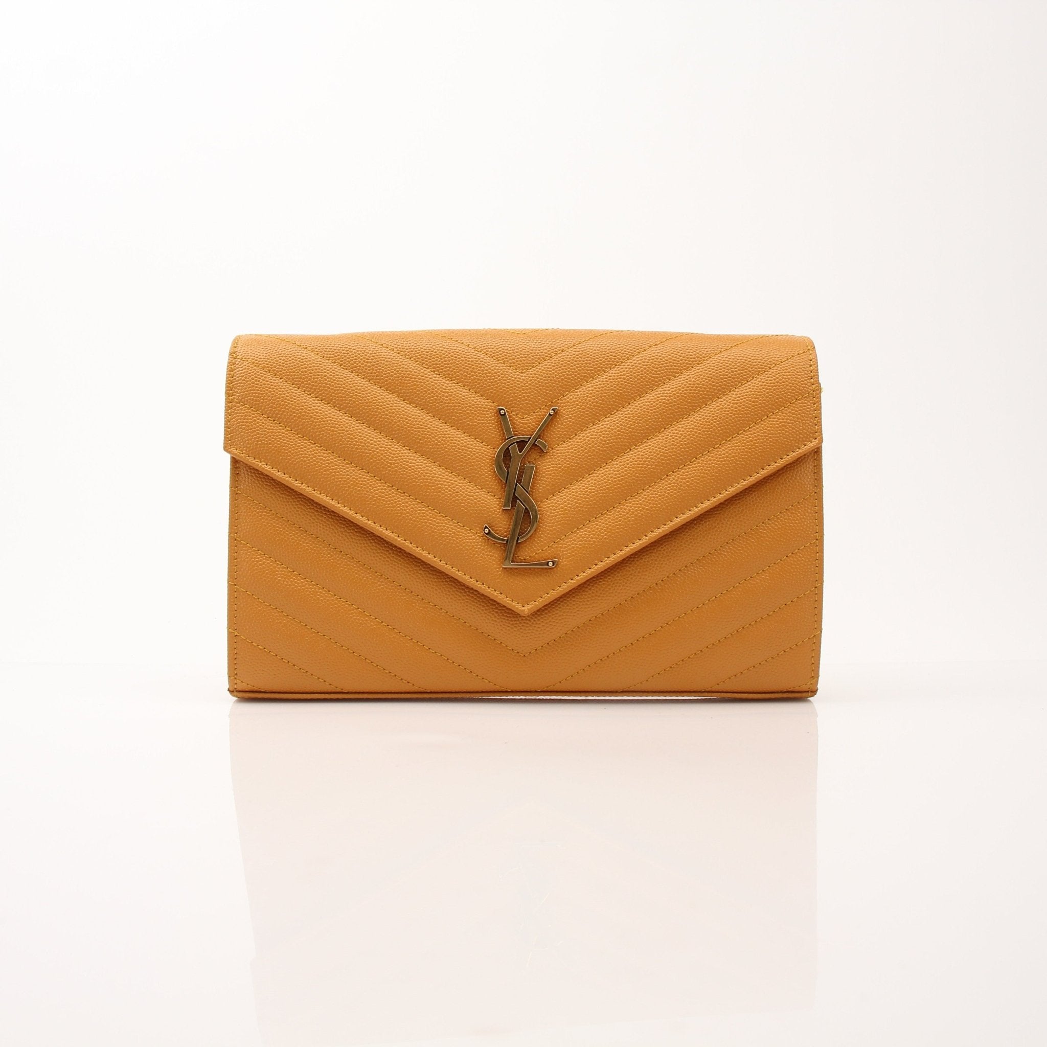 Saint Laurent Matelasse Chevron Monogram Chain Wallet handbag with gold chain and quilted leather, featuring iconic monogram pattern.