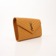 Gold & Beyond Saint Laurent Matelasse Chevron Monogram Chain Wallet handbag with quilted design and gold chain strap.