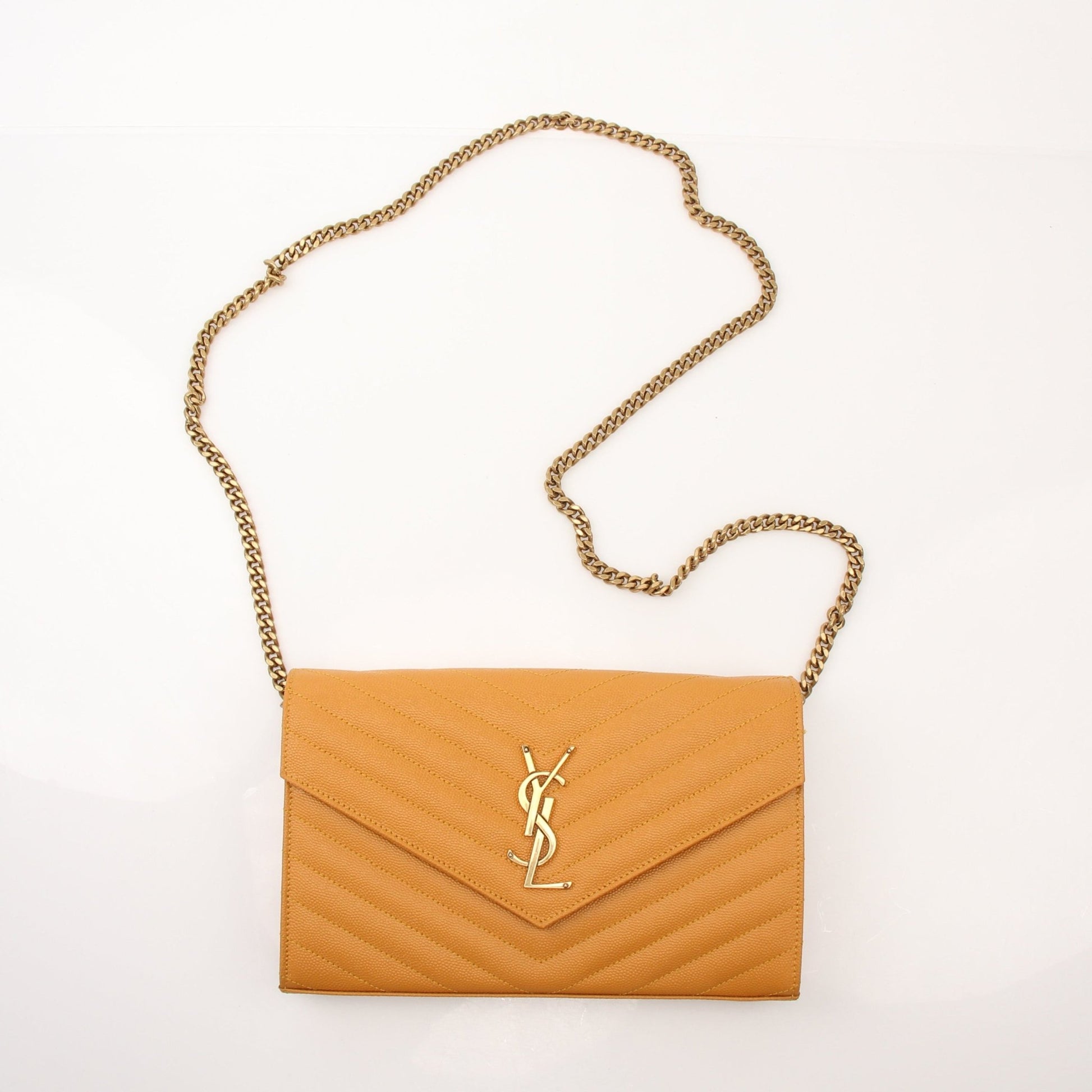 Saint Laurent Matelasse Chevron Monogram Chain Wallet handbag with gold chain and quilted design, stylish and compact accessory.