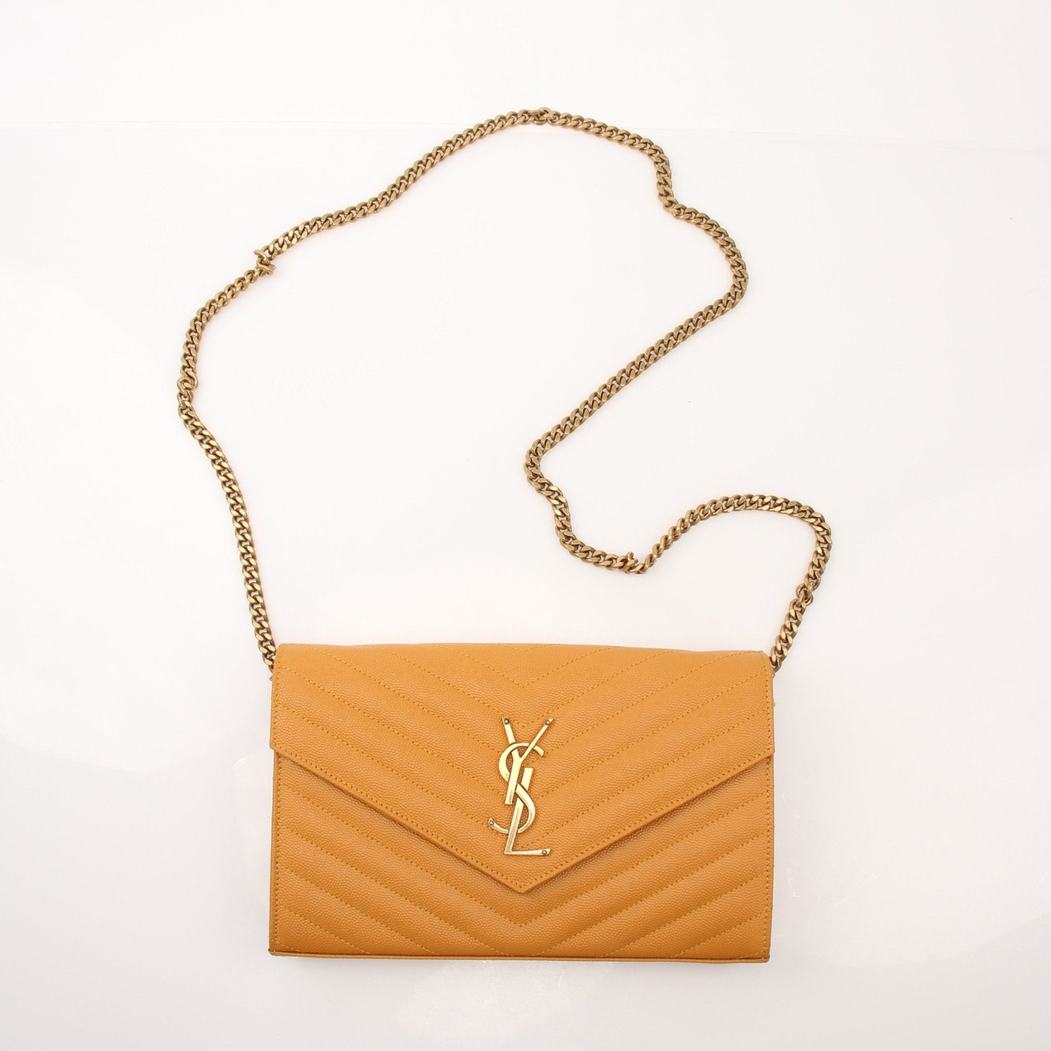 Saint Laurent Matelasse Chevron Monogram Chain Wallet handbag with gold chain and quilted design, stylish and compact accessory.