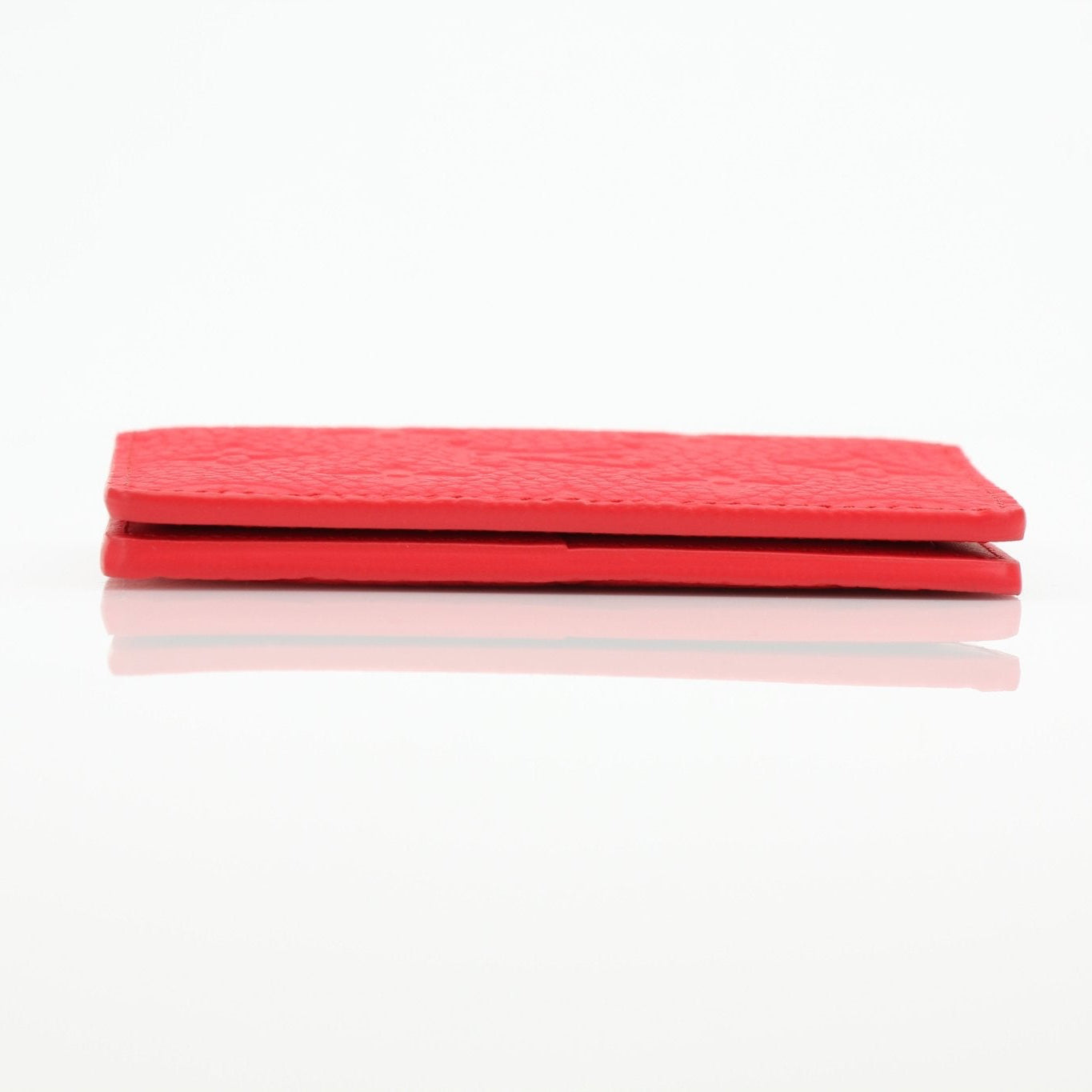 Louis Vuitton red Empreinte leather pocket organizer card holder with multiple card slots and gold hardware accents.