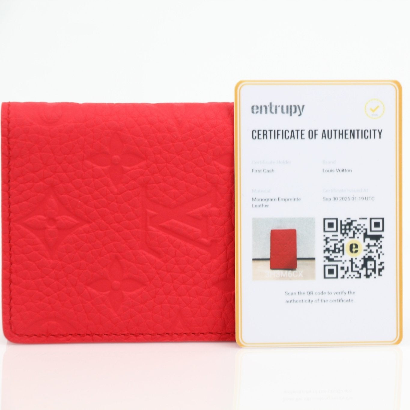 Louis Vuitton Red Empreinte leather pocket organizer card holder with multiple card slots and gold-tone details.