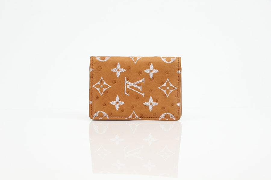 Louis Vuitton Pocket Organizer wallet in Monogram Leather with multiple card slots and a sleek design.