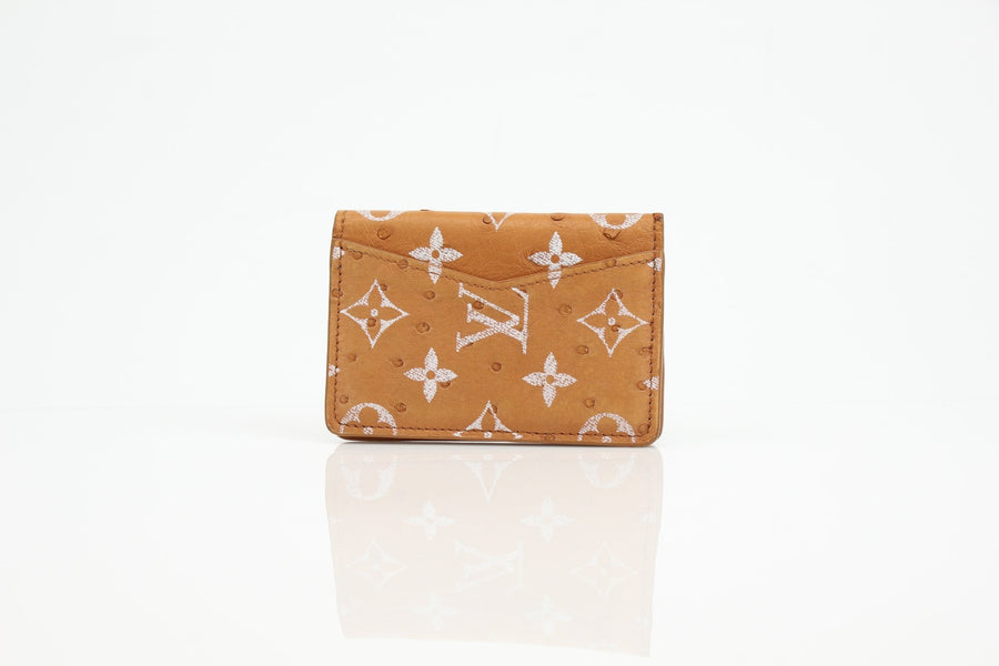 Louis Vuitton Monogram Leather Pocket Organizer wallet showcasing elegant design and classic logo detail.