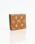 Louis Vuitton Pocket Organizer wallet in Monogram leather with multiple card slots and a sleek design.