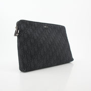 Christian Dior Black Oblique A4 Pouch handbag with gold accents, showcasing the signature Dior pattern and sleek design.
