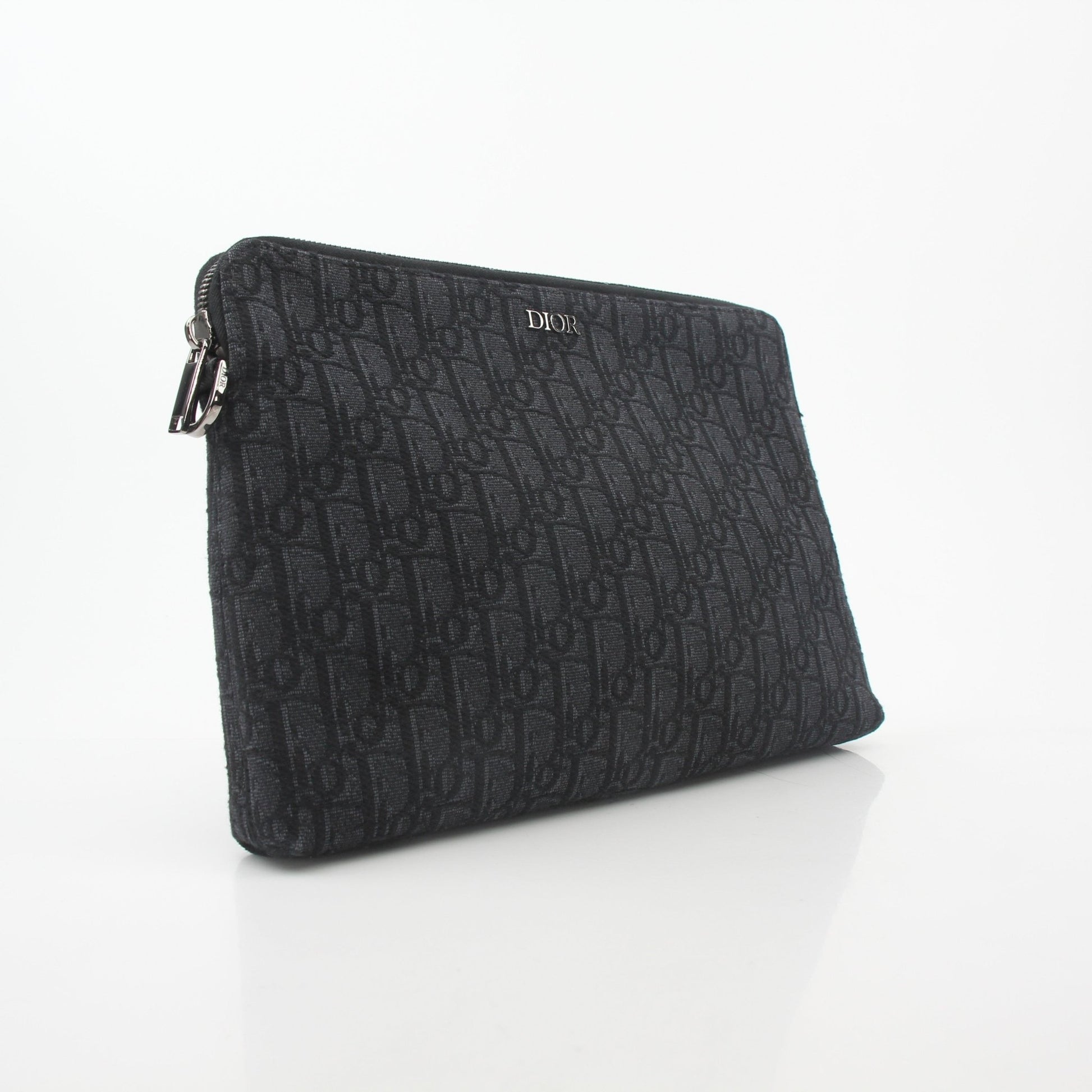 Christian Dior Black Oblique A4 Pouch handbag with gold accents, showcasing the signature Dior pattern and sleek design.
