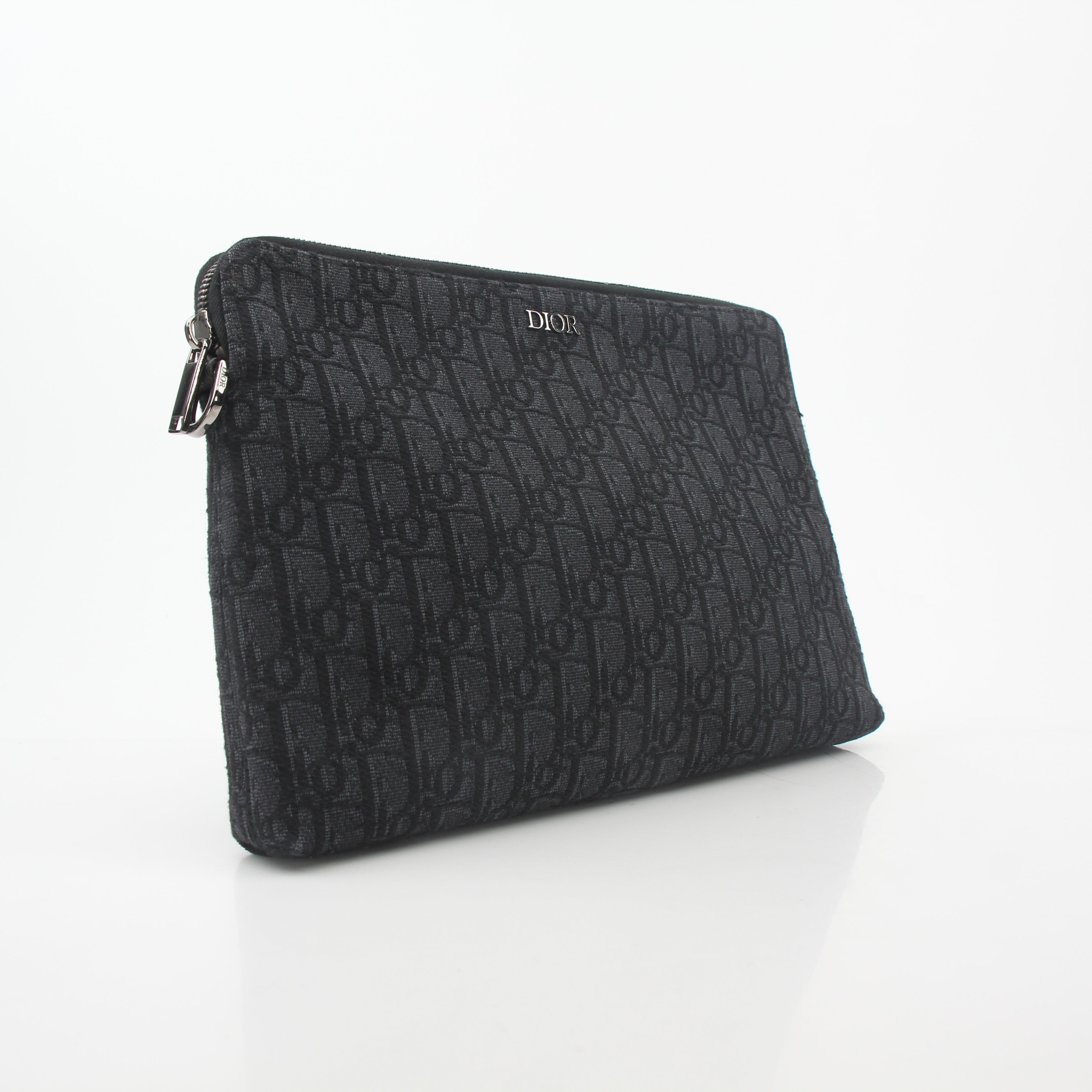 Christian Dior Black Oblique A4 Pouch handbag with gold accents, showcasing the signature Dior pattern and sleek design.