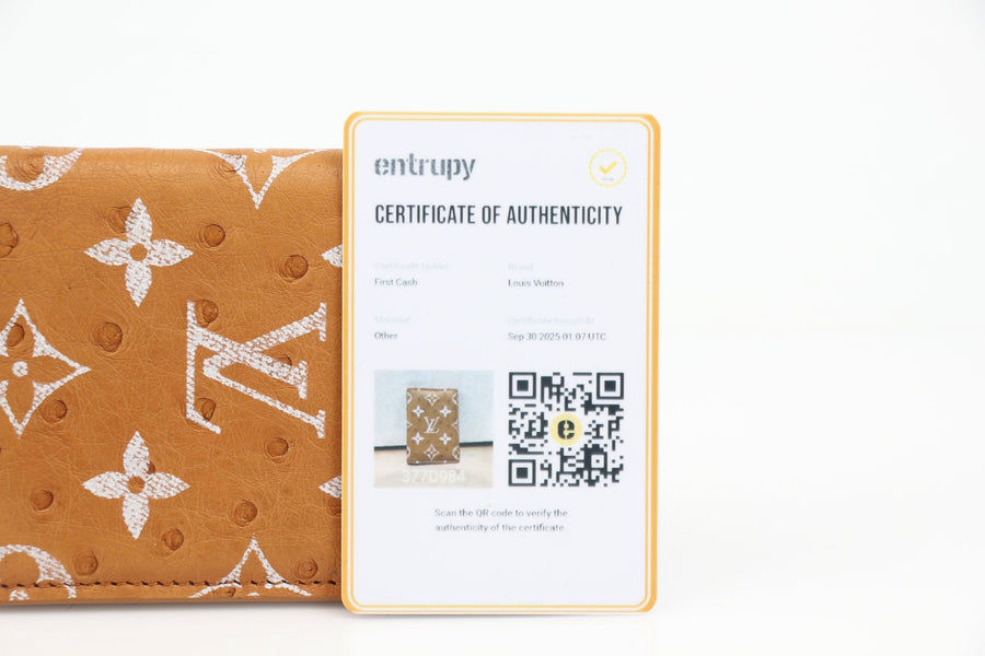 Louis Vuitton Monogram Leather Pocket Organizer wallet with multiple card slots and a sleek design.