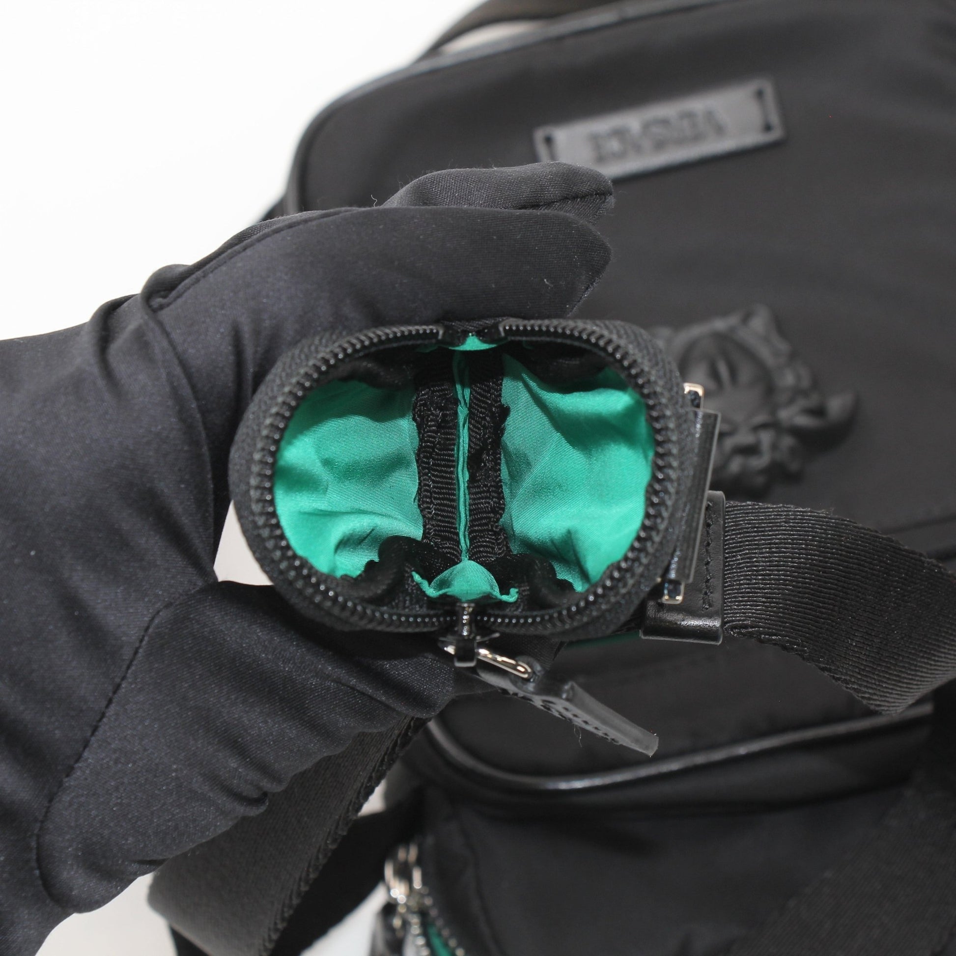 Gold & Beyond Versace Men’s Medusa Head nylon crossbody bag with adjustable strap and signature Medusa logo detail.