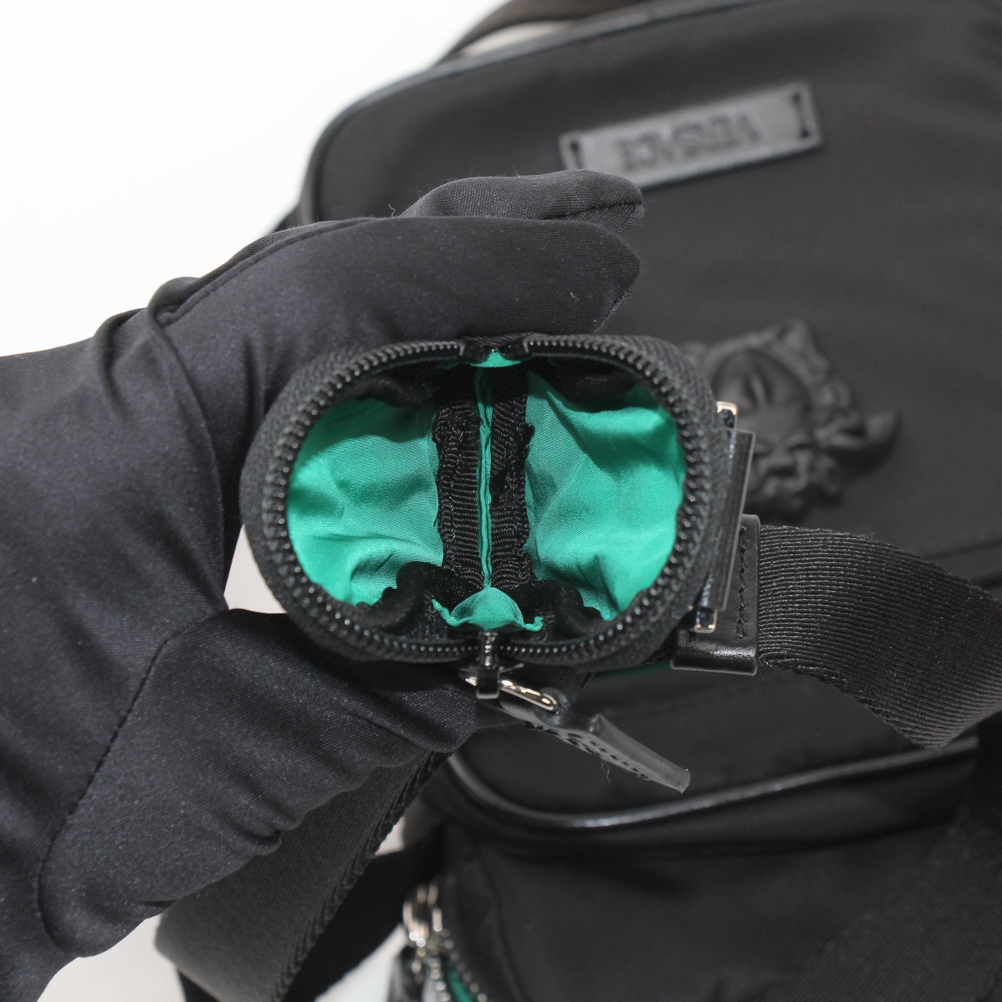 Gold & Beyond Versace Men’s Medusa Head nylon crossbody bag with adjustable strap and signature Medusa logo detail.