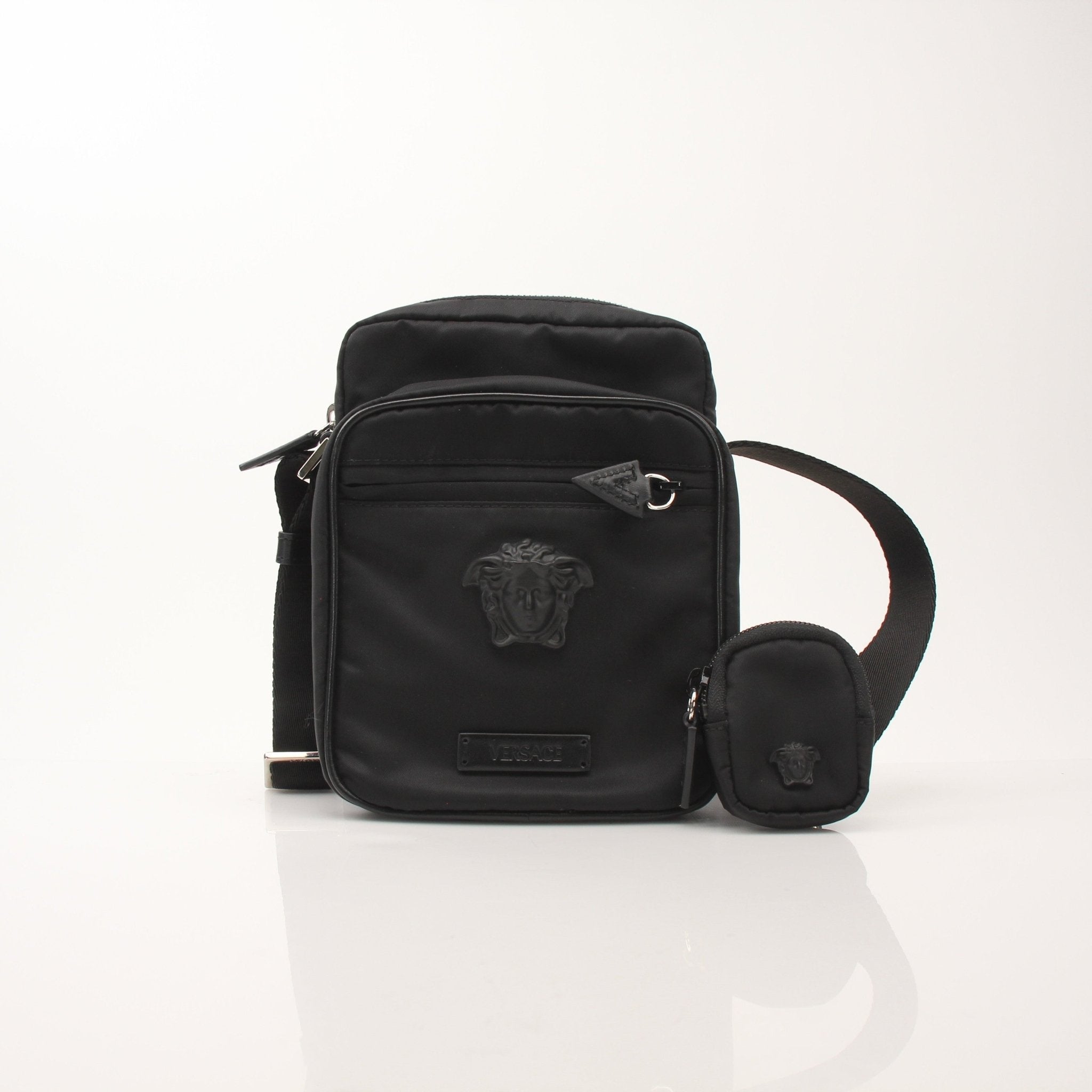 Versace Men’s Medusa Head nylon crossbody handbag with adjustable strap and gold accents, featuring iconic Medusa logo.