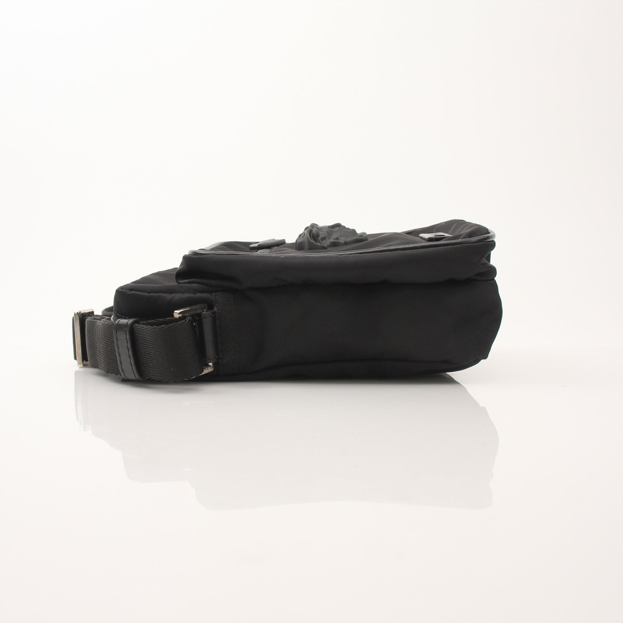 Gold & Beyond Versace men's nylon crossbody handbag with Medusa head logo, featuring a sleek design and adjustable strap.