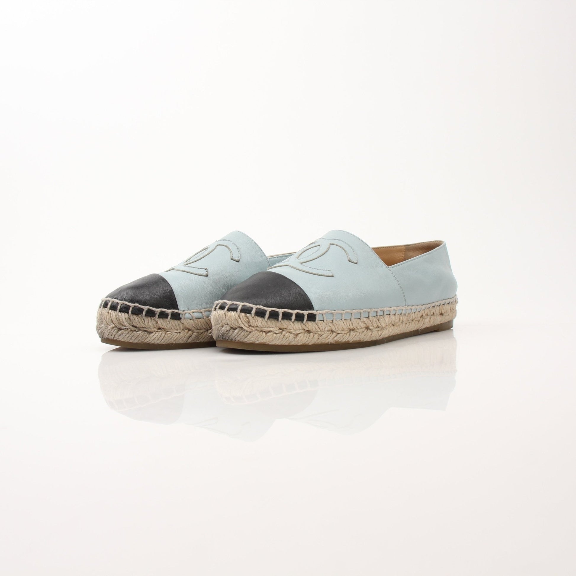 Chanel Women’s CC Leather Espadrilles, gold and black shoes with signature logo and woven jute sole, close-up view.