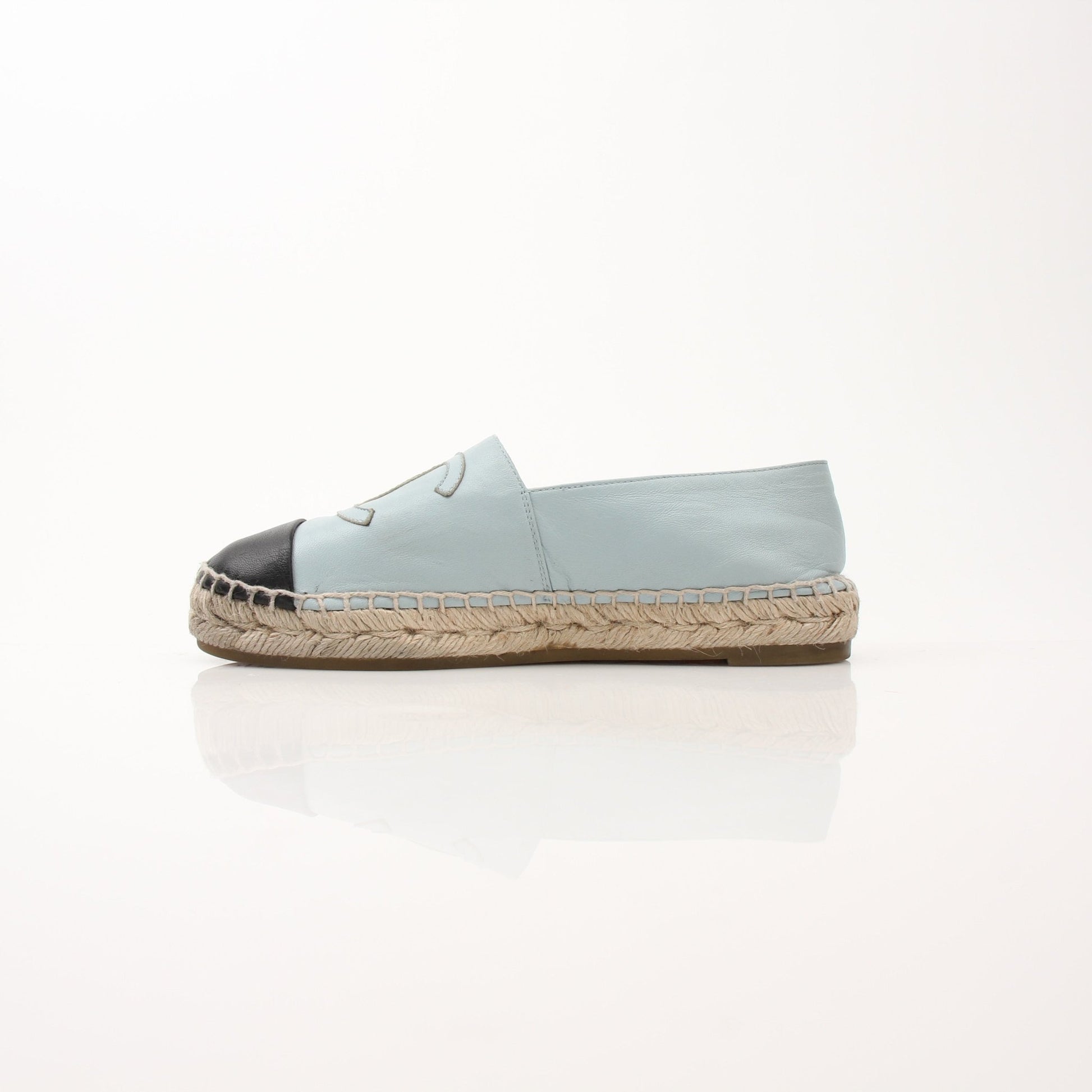 Gold & Beyond Chanel women’s CC leather espadrille shoes with woven jute soles and classic CC logo accents.