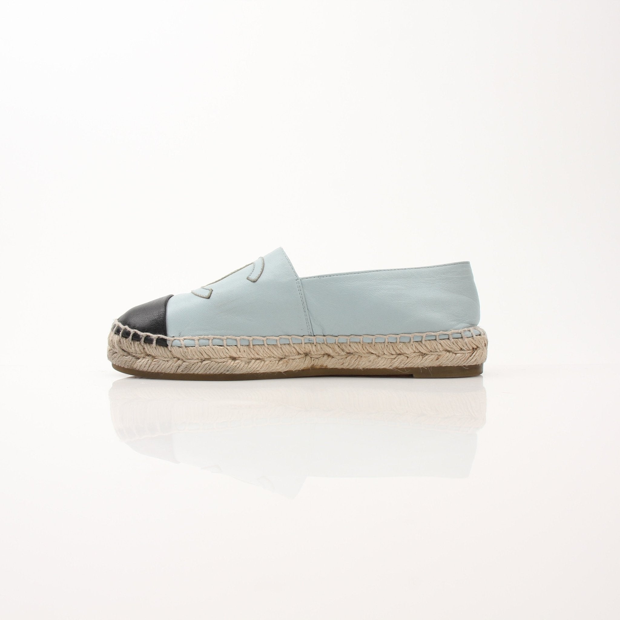 Gold & Beyond Chanel women’s CC leather espadrille shoes with woven jute soles and classic CC logo accents.