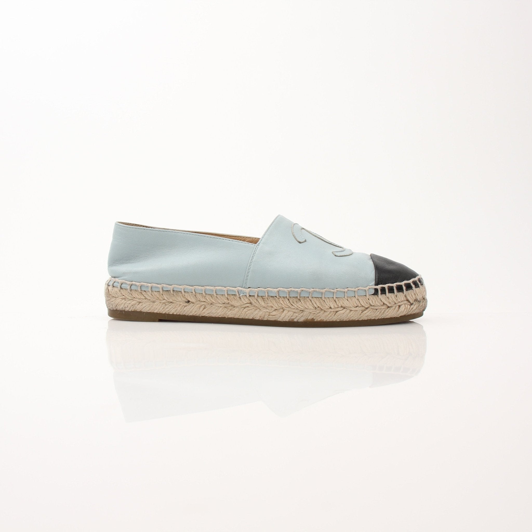 Chanel women’s CC leather espadrille shoes with woven sole and logo detail, displayed on a neutral background.