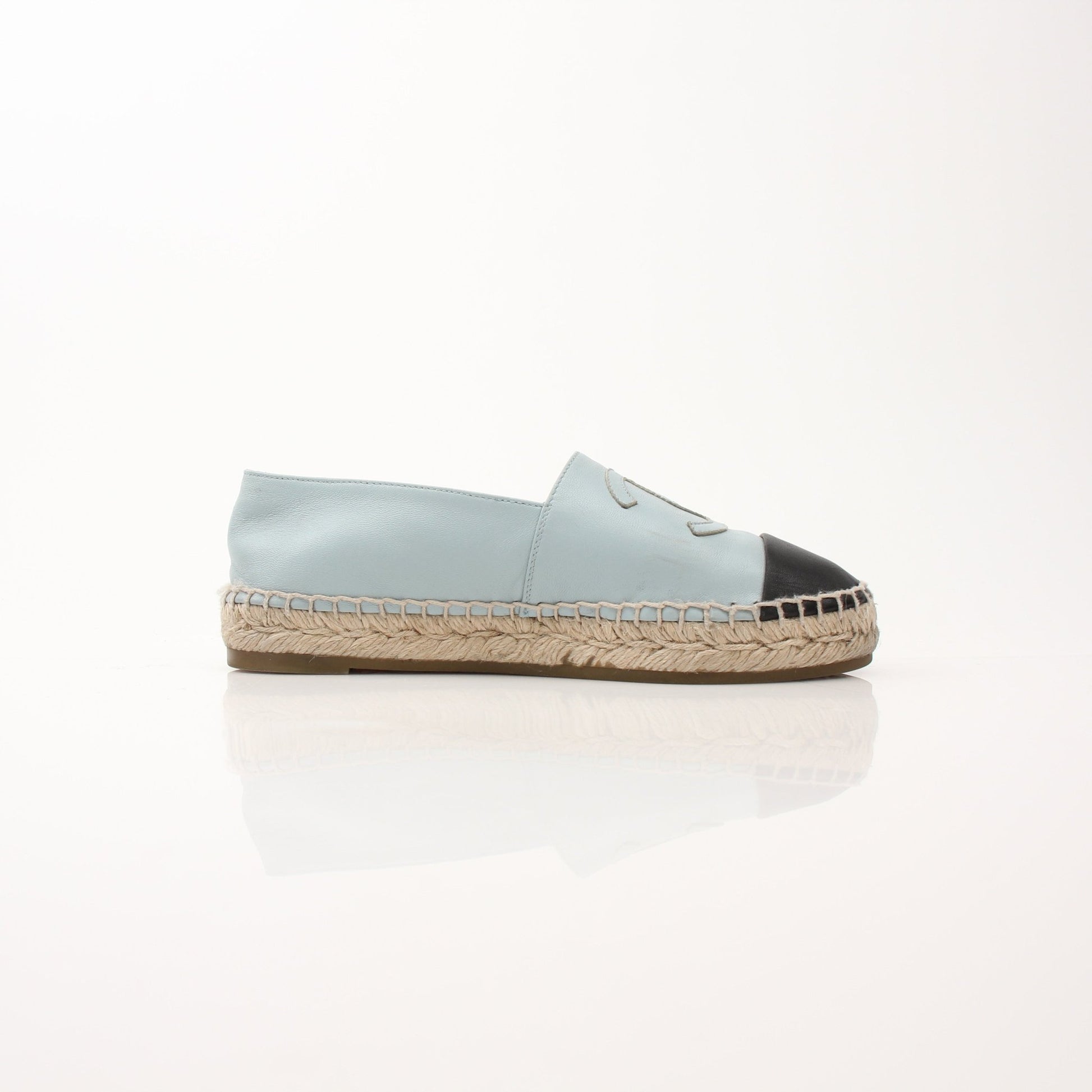 Gold & Beyond Chanel women’s CC leather espadrille shoes featuring classic design and comfortable slip-on style.