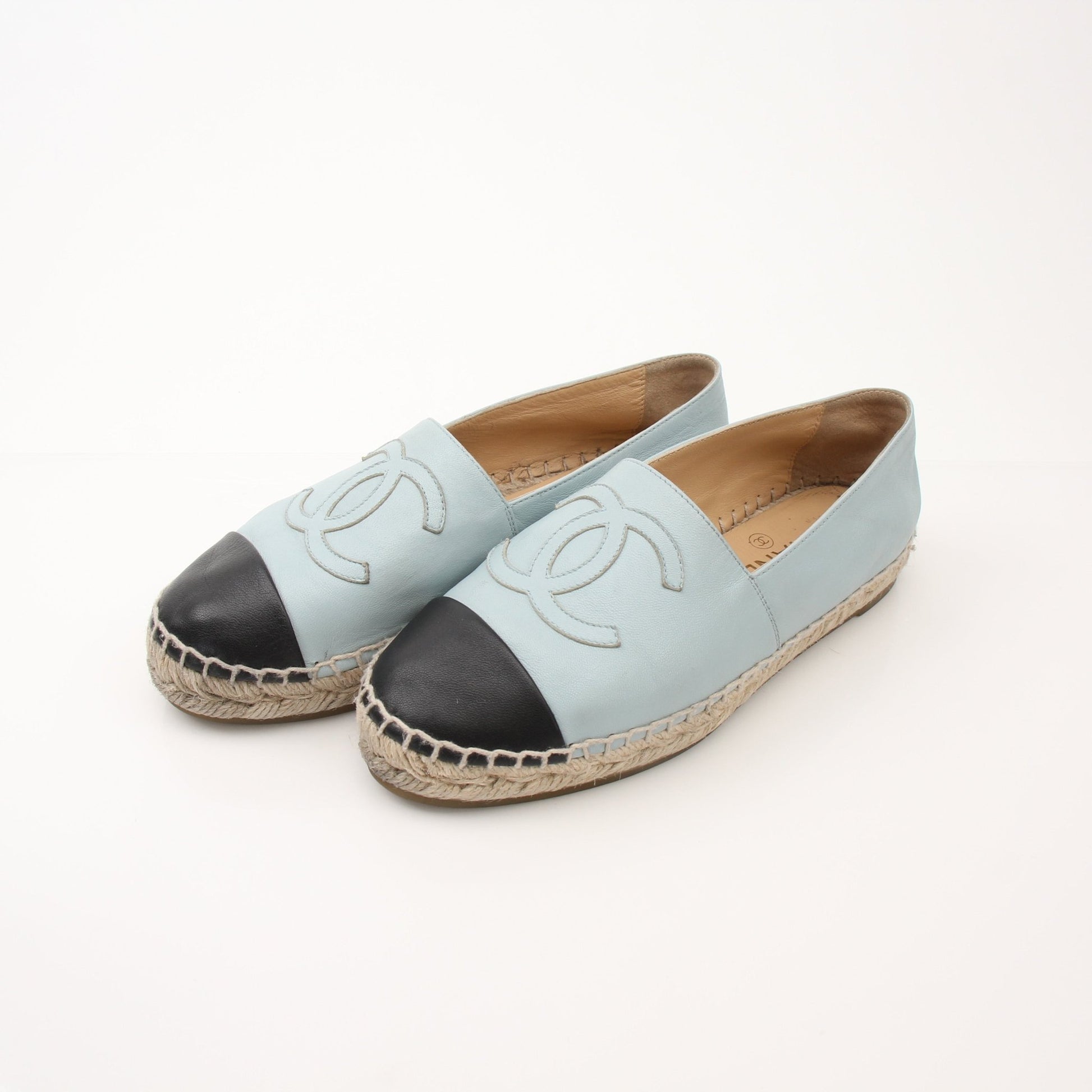 Gold & Beyond Chanel women’s CC leather espadrille shoes with beige woven sole and signature logo detail.