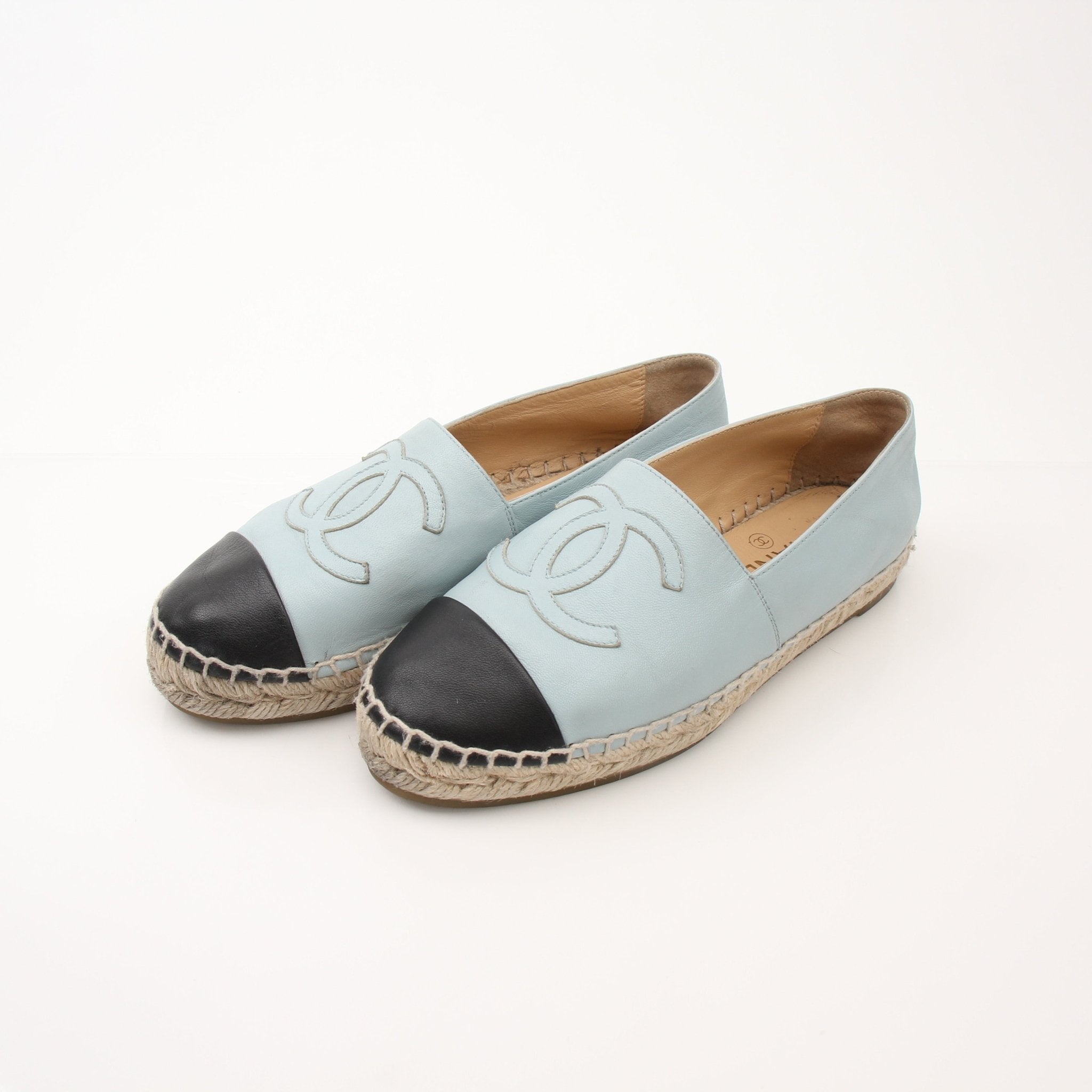 Gold & Beyond Chanel women’s CC leather espadrille shoes with beige woven sole and signature logo detail.