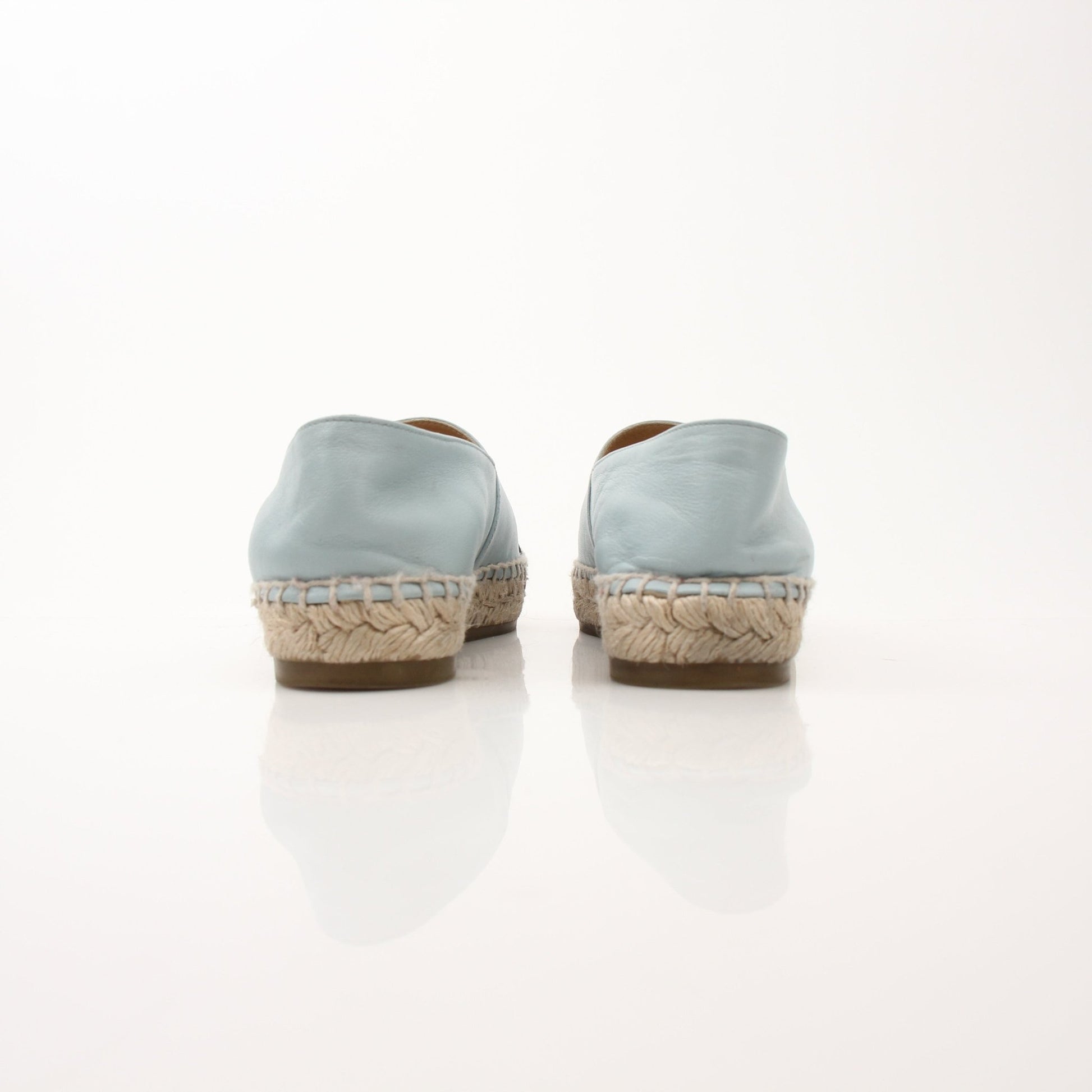 Gold & Beyond Chanel women’s CC leather espadrille shoes with woven jute soles and classic CC logo detail.