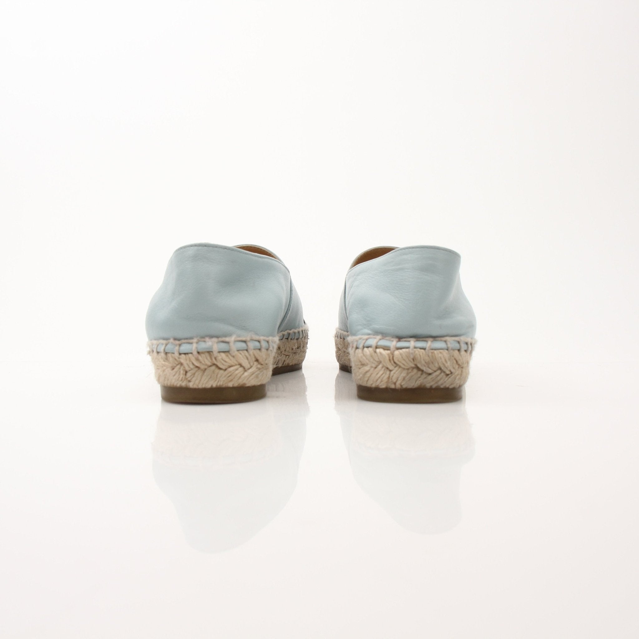 Gold & Beyond Chanel women’s CC leather espadrille shoes with woven jute soles and classic CC logo detail.