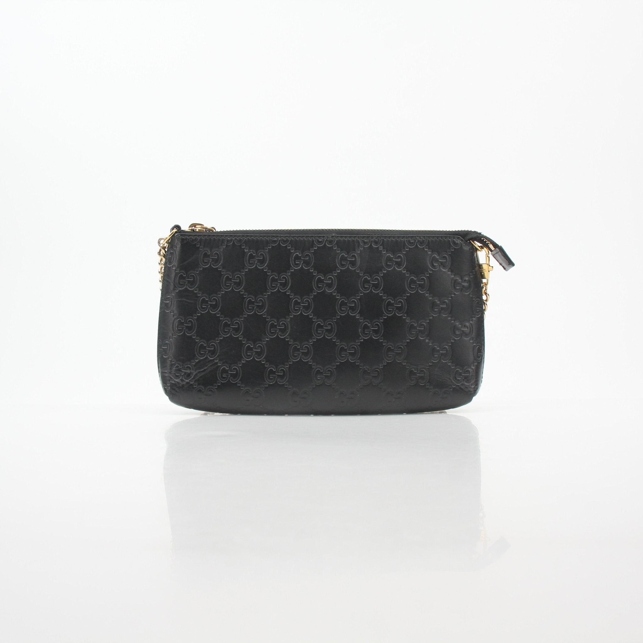 Gucci Black Microguccissima Chain Pouch handbag with gold chain strap and signature pattern, stylish and compact accessory.