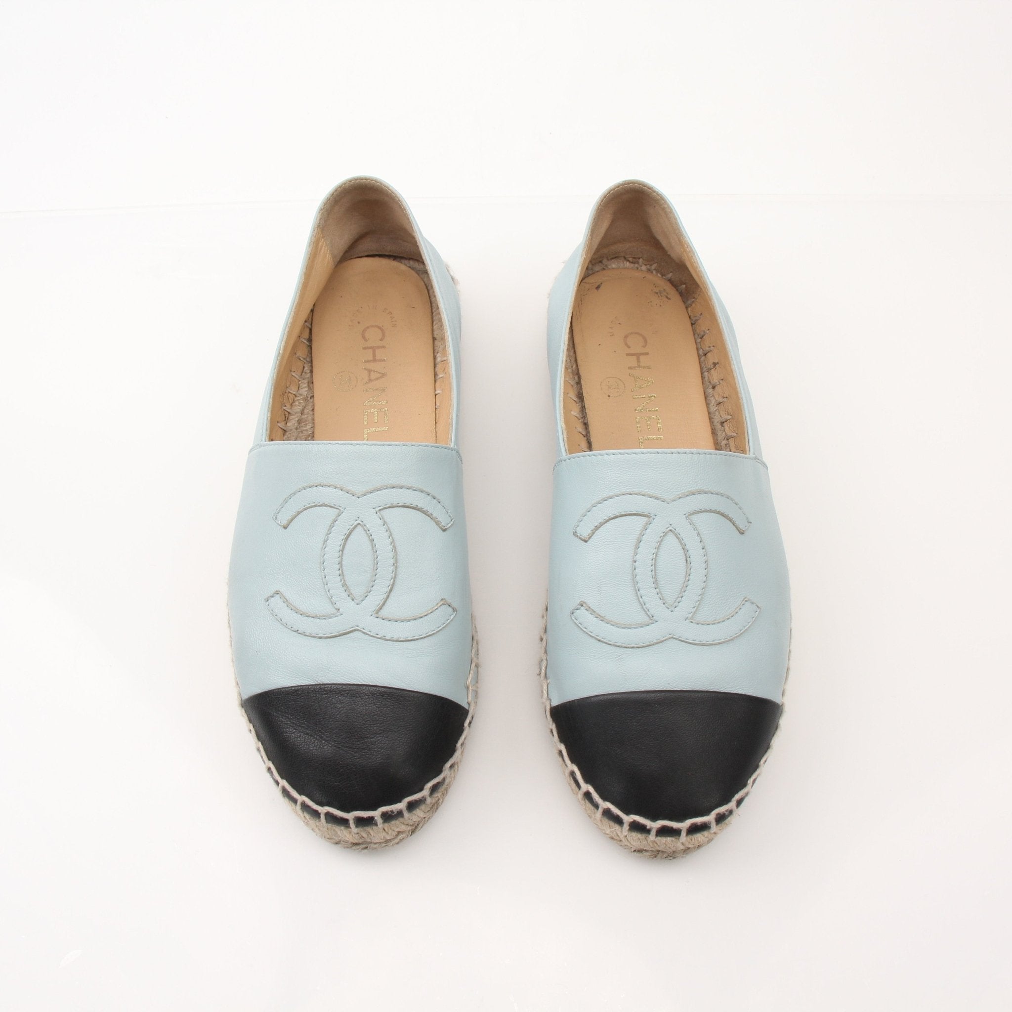 Gold & Beyond Chanel women’s CC leather espadrille shoes with woven soles and logo detail, perfect for casual or stylish wear.
