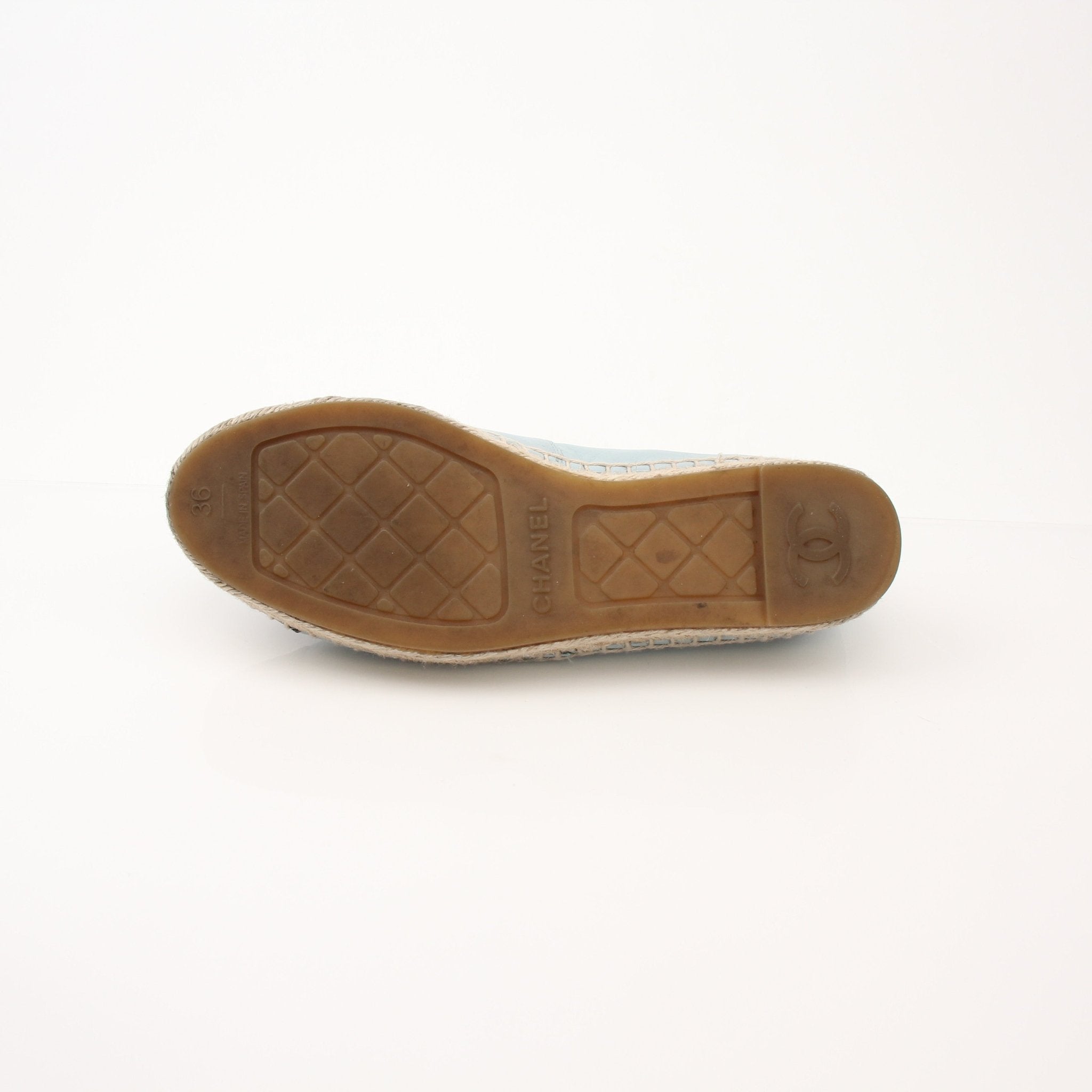 Chanel Women’s CC Leather Espadrilles in black with beige sole and iconic CC logo, slip-on shoes with woven jute sole.