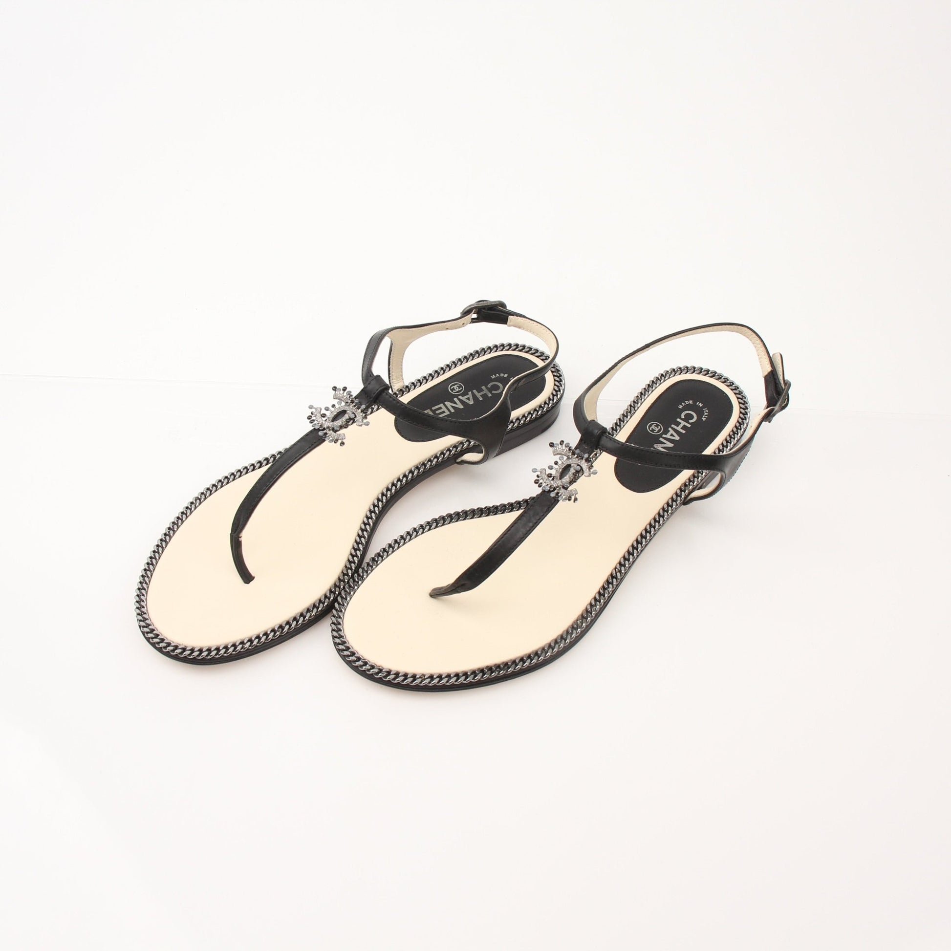 Gold & Beyond Chanel women’s chain trim thong sandals featuring sleek shoes with stylish chain accents and comfortable design.