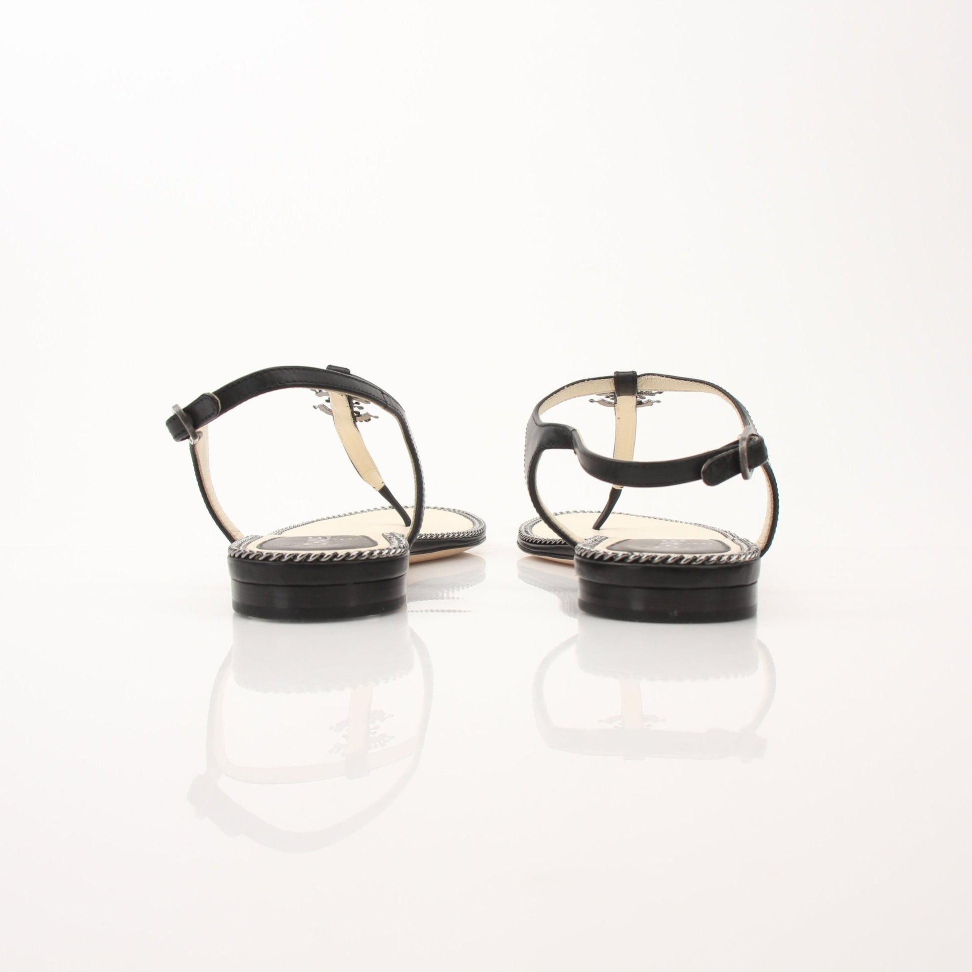 Gold & Beyond Chanel women’s chain trim thong sandals, stylish shoes with a sleek design and elegant chain detail.