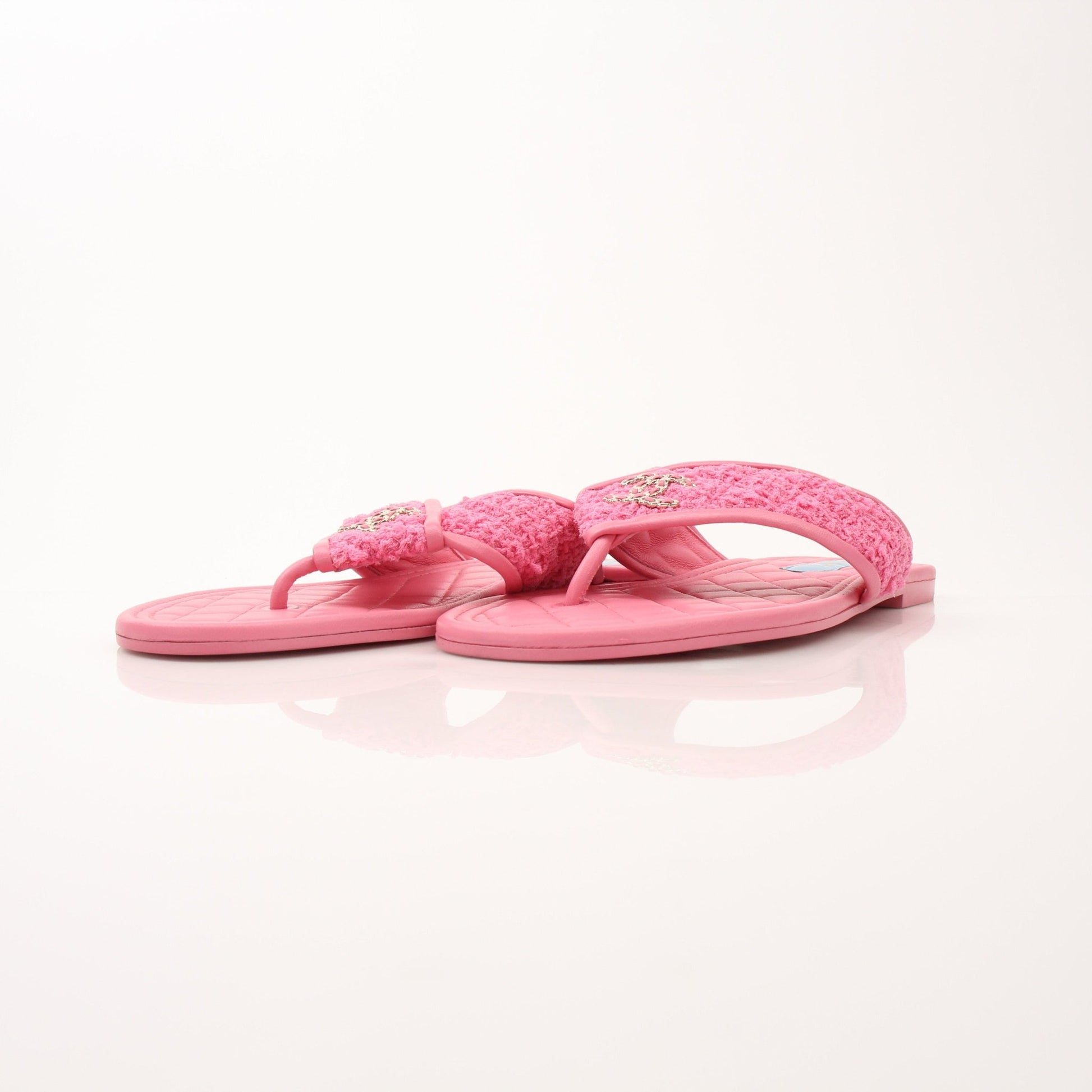 Gold & Beyond Chanel Women’s CC Tweed Thong Sandals, stylish shoes with tweed detail and thong design, close-up view of the footwear.