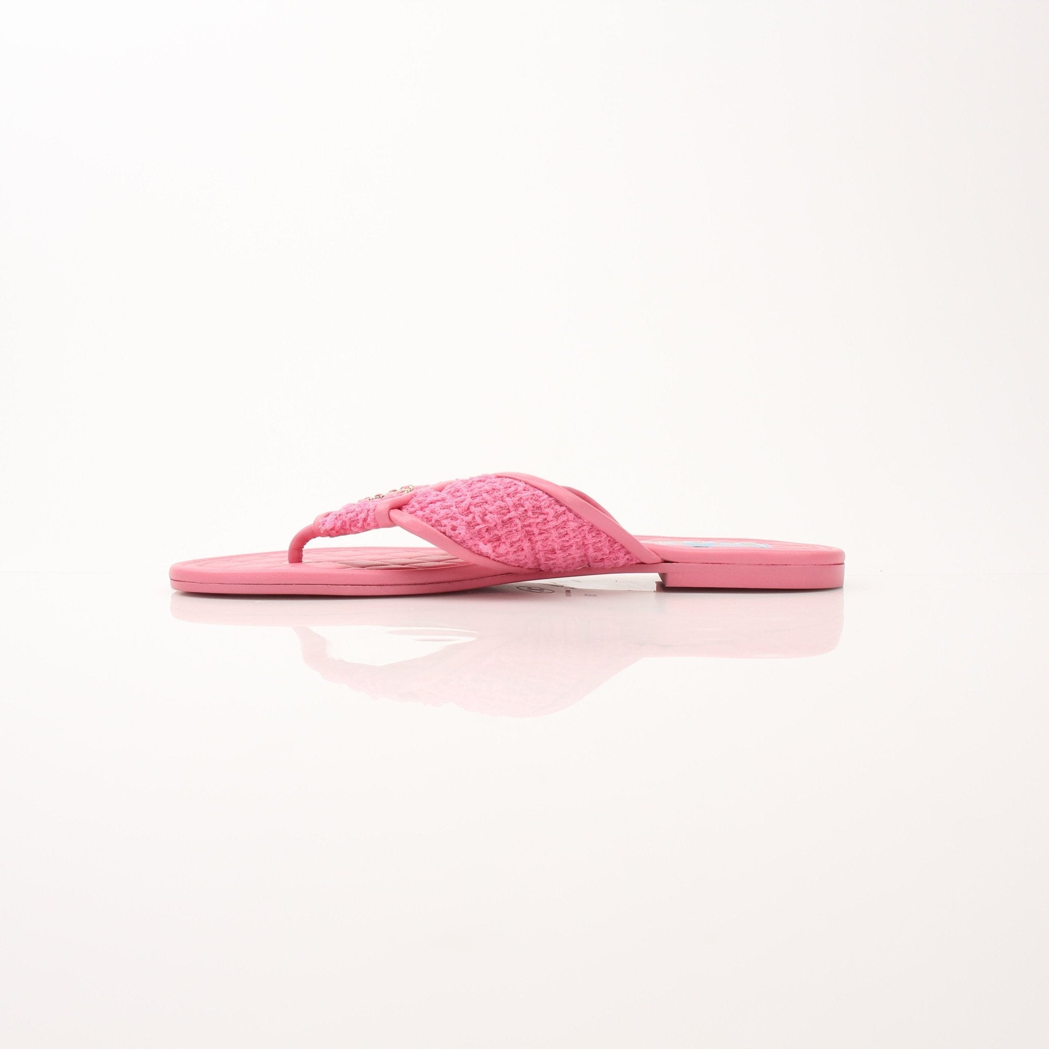 Chanel Women’s CC Tweed Thong Sandals in black and beige, stylish shoes with iconic CC logo, displayed on a neutral background.