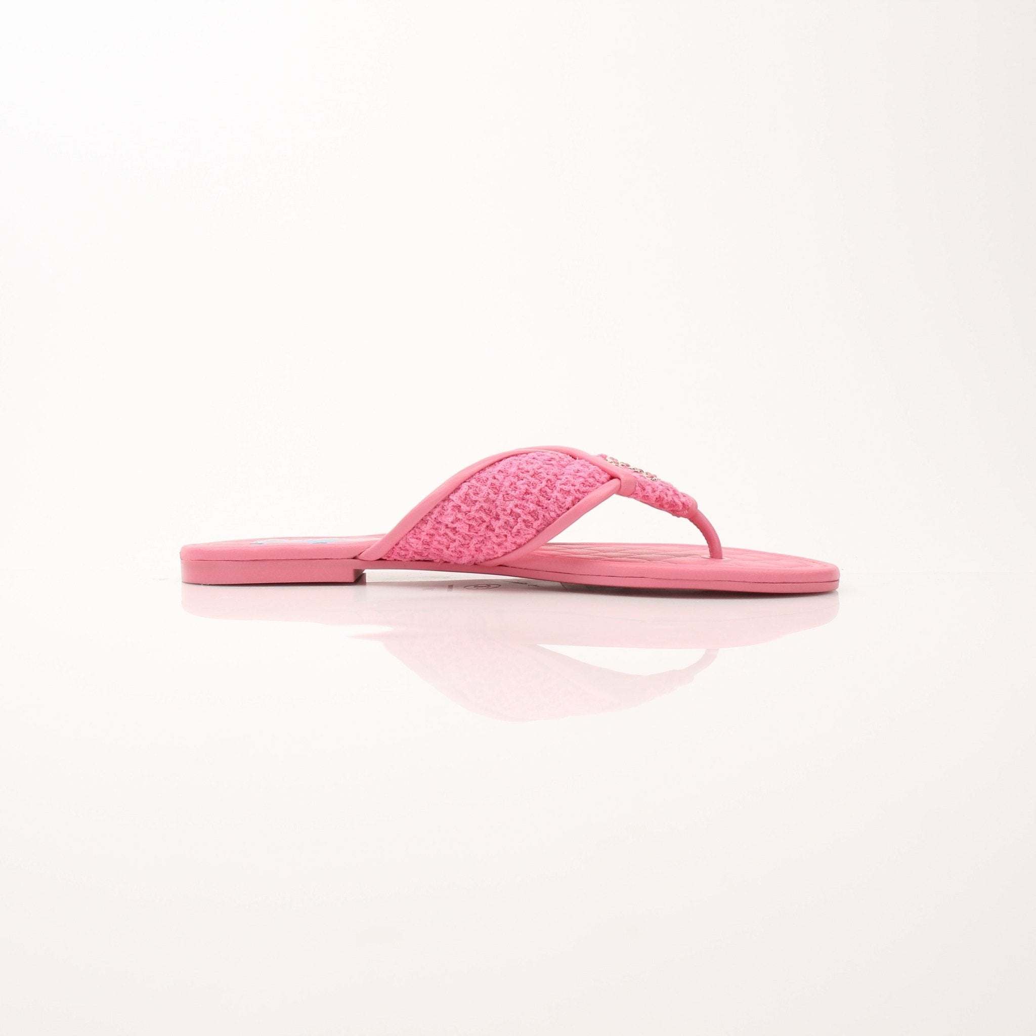 Gold & Beyond Chanel CC Tweed thong sandals for women, featuring pointed toes and tweed strap details.