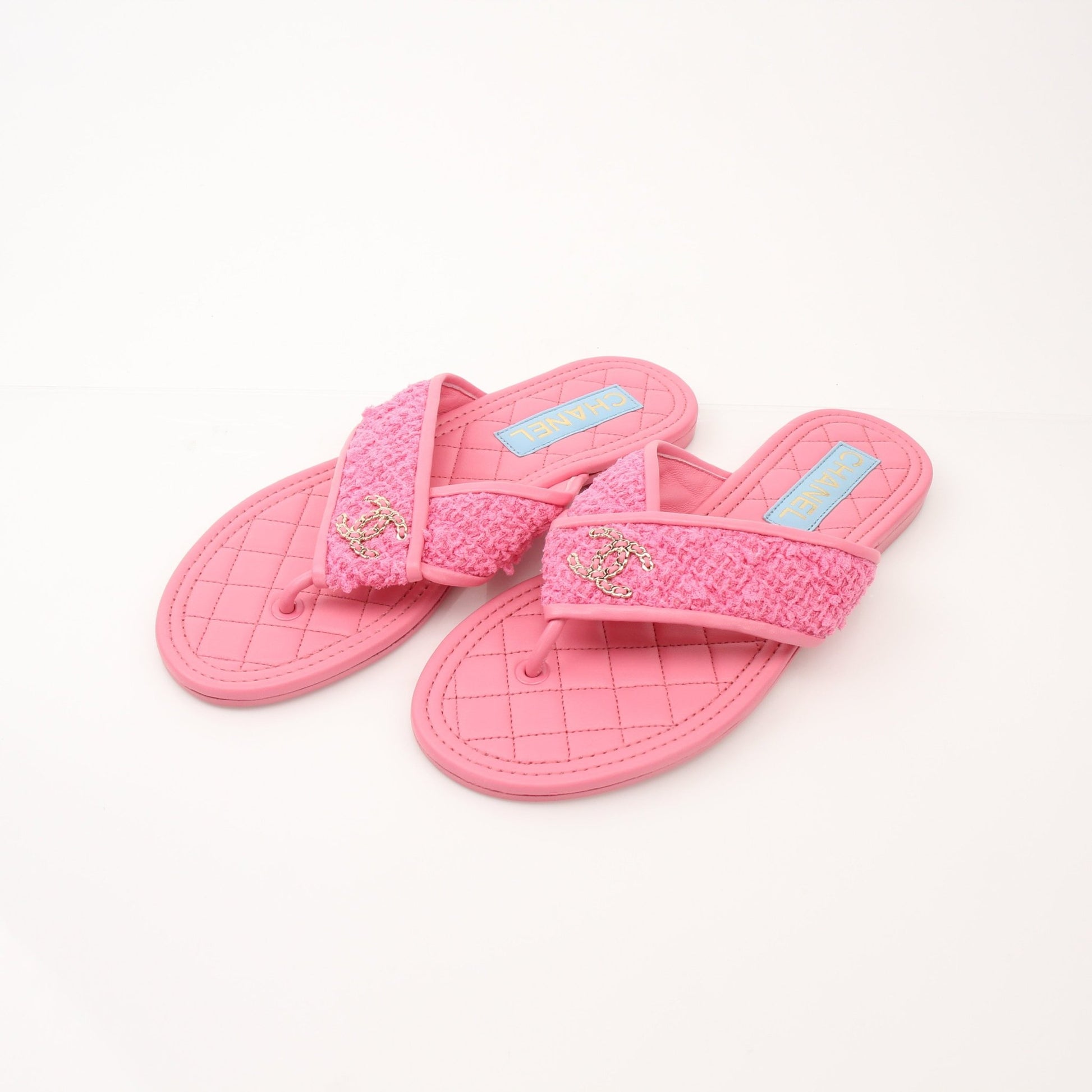 Gold & Beyond Chanel CC Tweed thong sandals, women's shoes featuring tweed straps and thong design, on a neutral background.