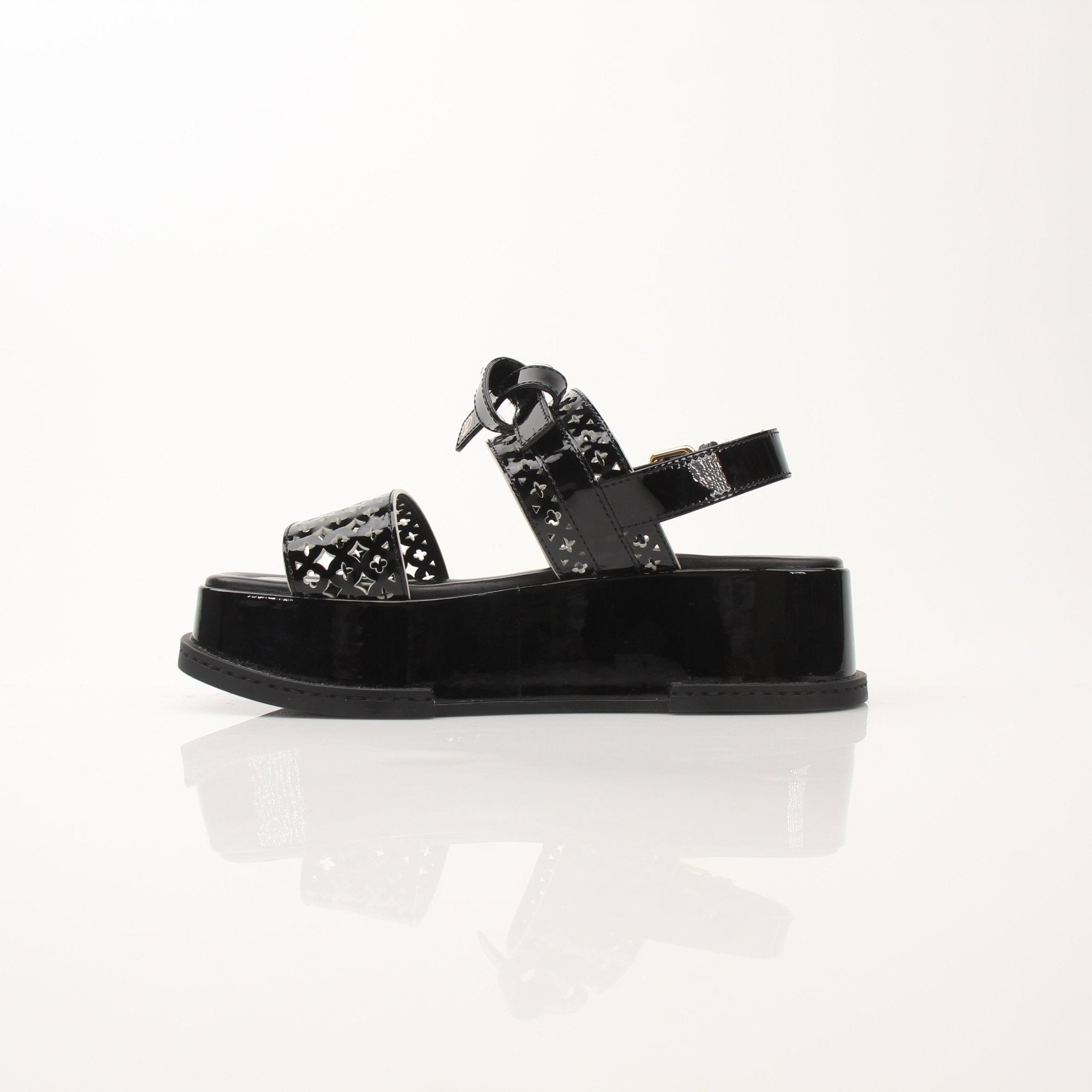 Louis Vuitton Women’s Maya Comfort Sandals in beige with gold accents, featuring a sleek design and comfortable straps.