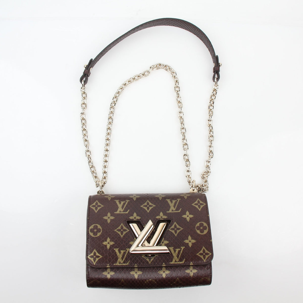 Louis Vuitton Brown Monogram Python Twist PM crossbody handbag with gold hardware and adjustable strap, stylish and compact.