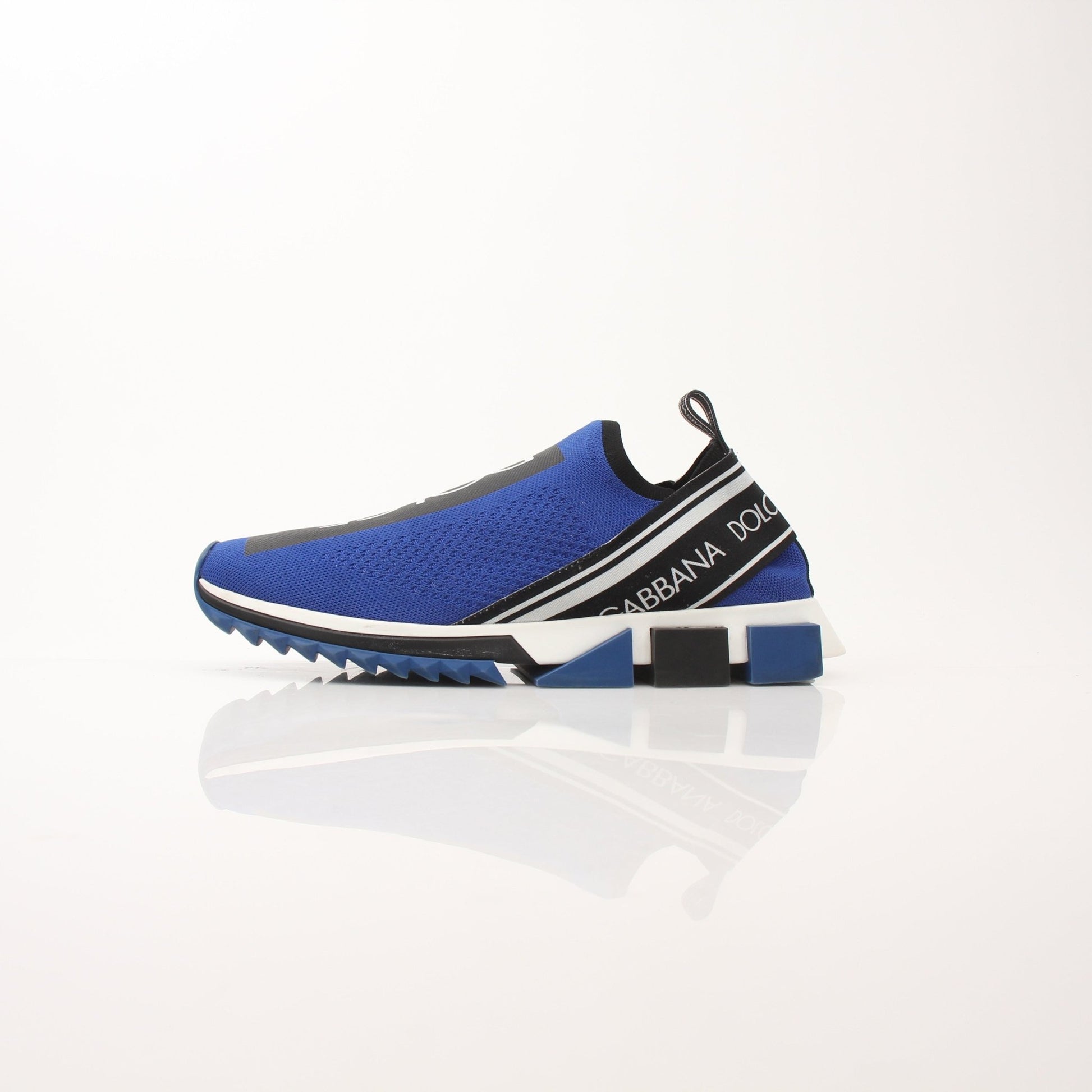 Gold & Beyond men's Dolce & Gabbana Sorrento slip-on sneakers showing black shoes with sleek design and subtle branding details.