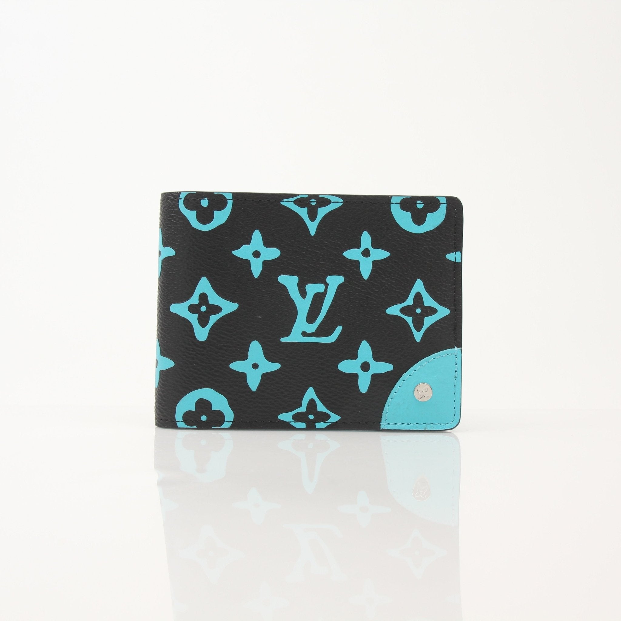 Louis Vuitton Playground Slender Wallet by Gold & Beyond, featuring sleek leather design with multiple card slots and compact silhouette.