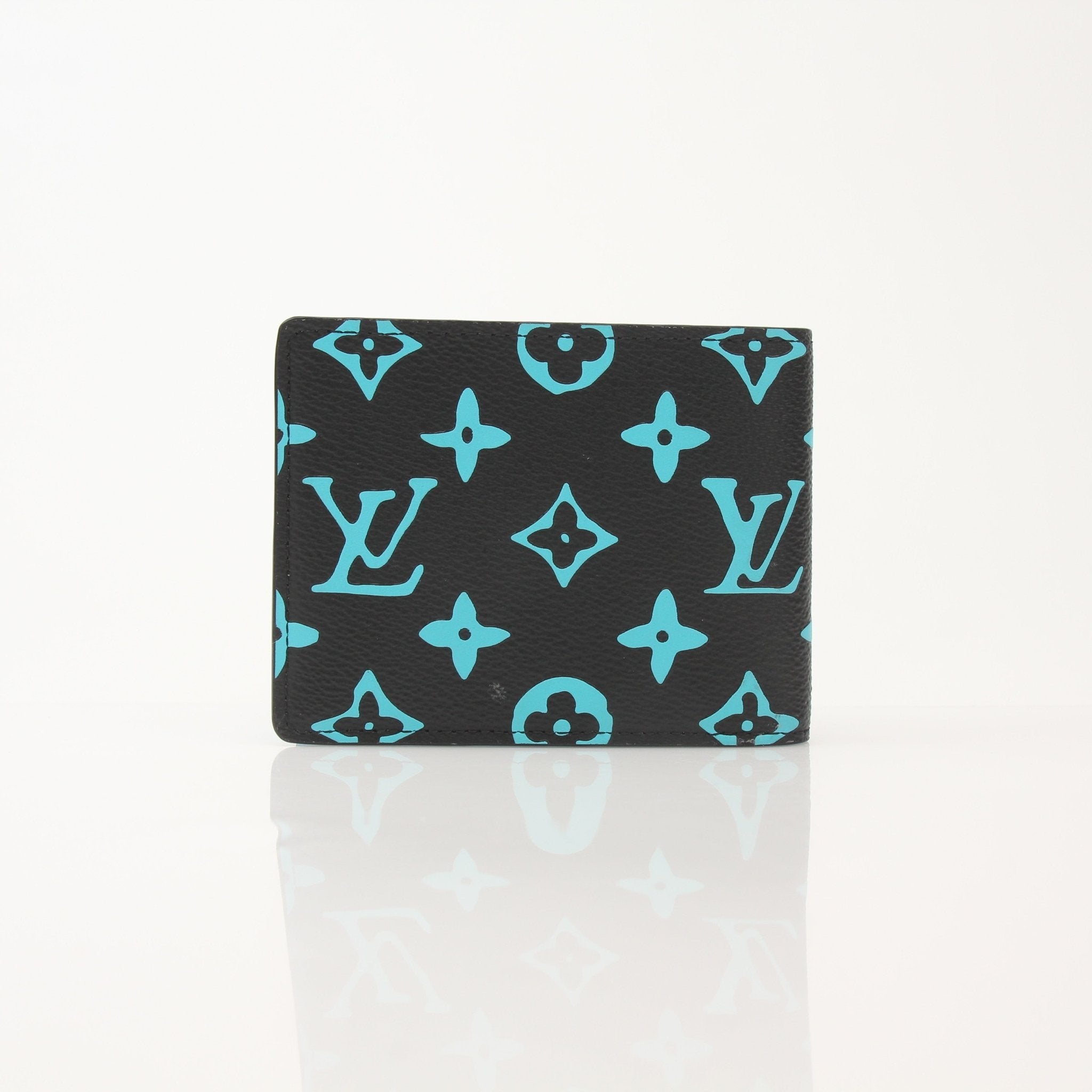 Gold & Beyond Louis Vuitton Playground Slender Wallet, sleek leather wallet with multiple card slots and compact design.