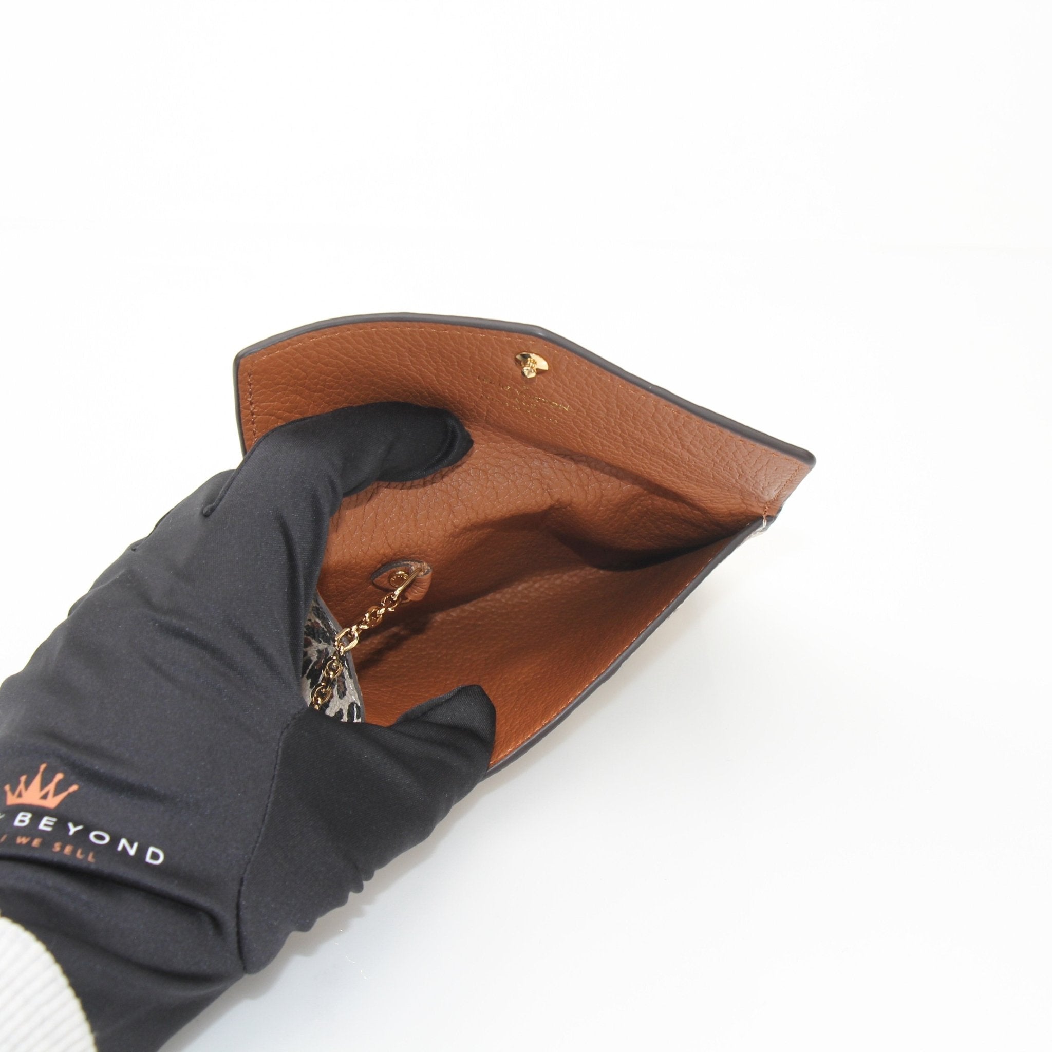 Louis Vuitton Wild at Heart wallet by Gold & Beyond showing the signature patterned leather wallet with gold hardware details.