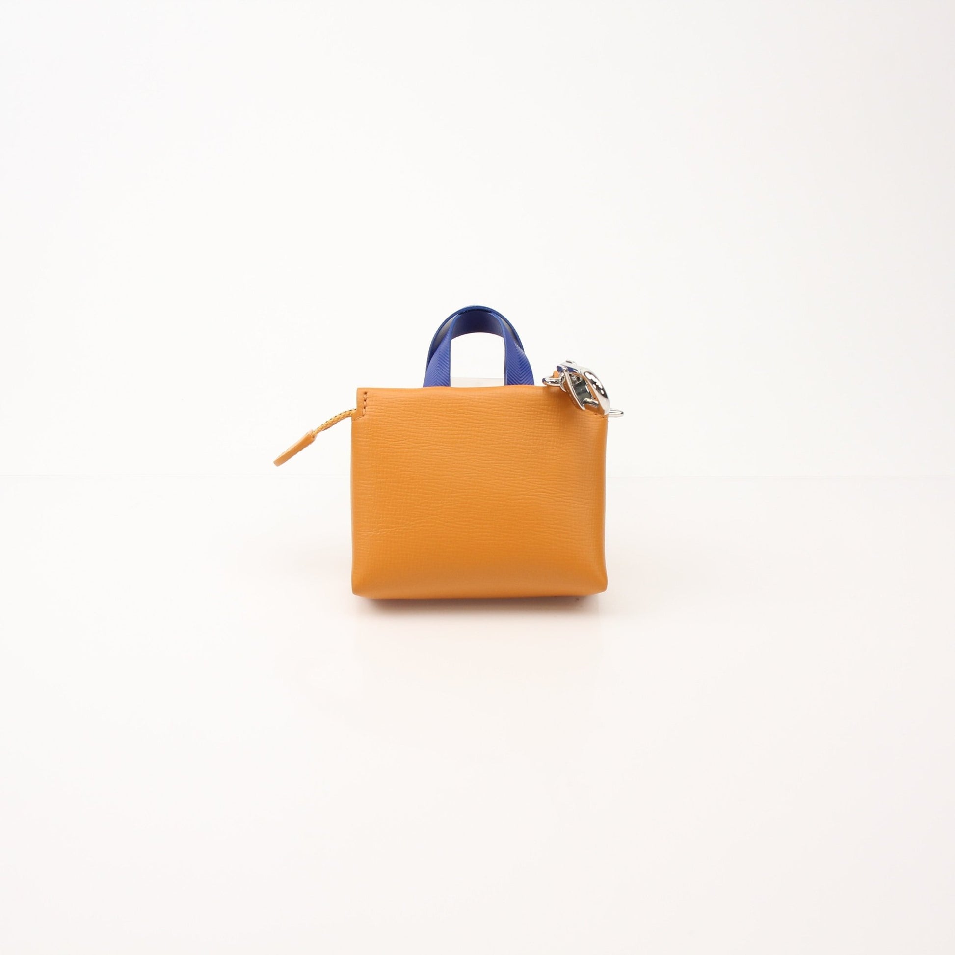 Louis Vuitton Mini Tote Charm Bag Charm accessory by Gold & Beyond, featuring gold-tone metal and detailed Louis Vuitton branding.
